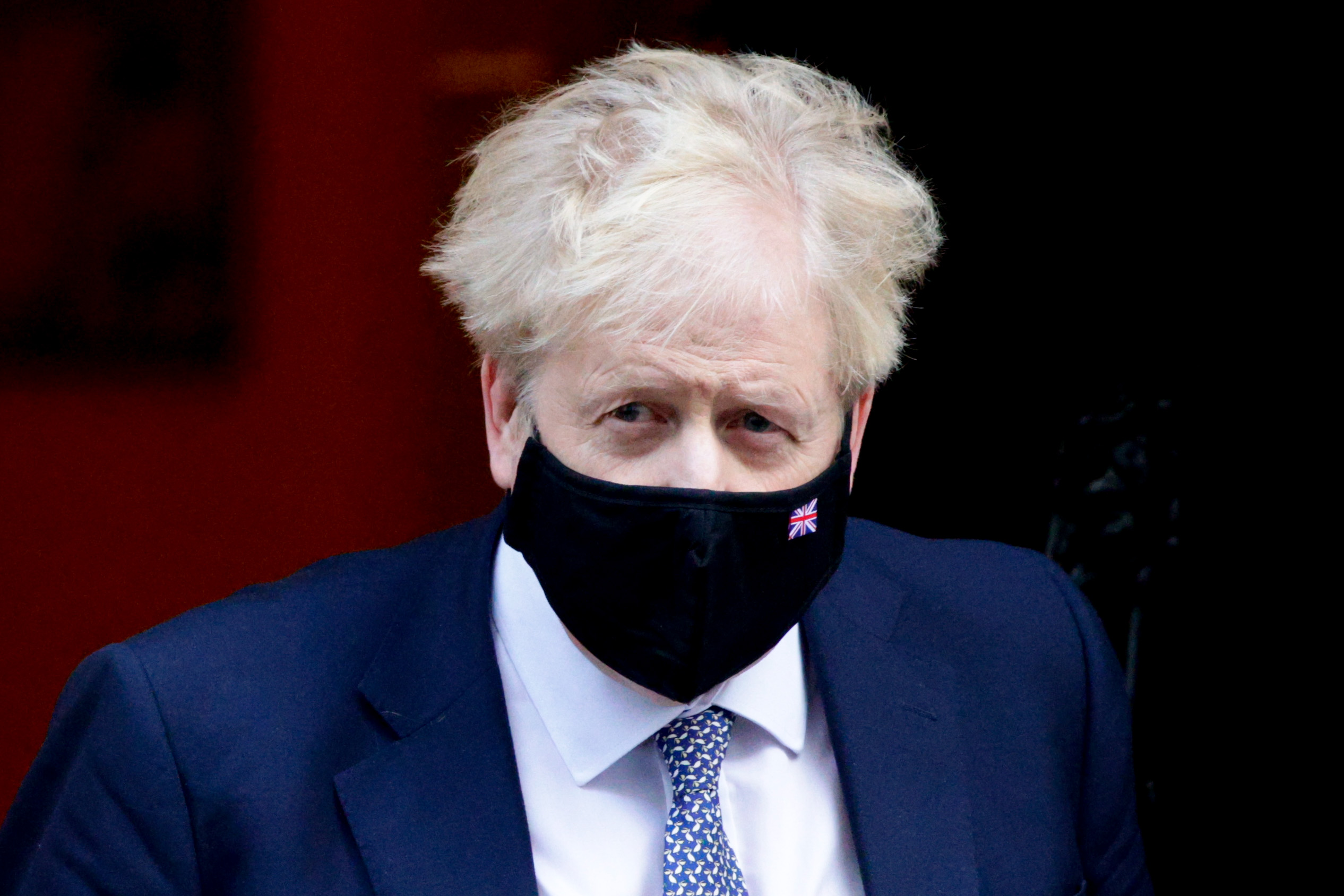 British Prime Minister Boris Johnson leaves 10 Downing Street for his weekly Prime Minister's Questions (PMQs) appearance in the House of Commons in London, England, on January 12, 2022.