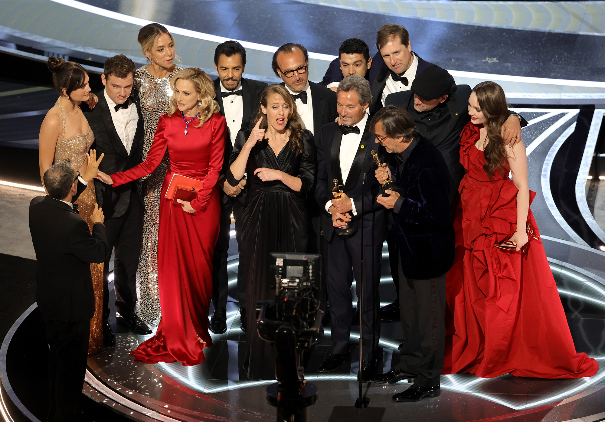 The cast and crew of "Coda" accept the best picture award onstage during the 94th Annual Academy Awards.
