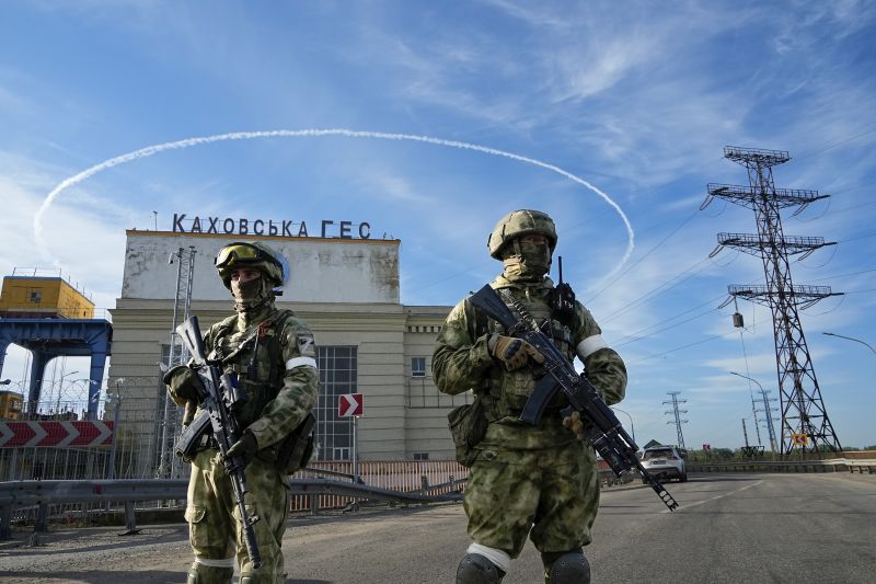 Russian troops guard an entrance of the Kakhovka Hydroelectric Power Plant in Kherson Oblast on May 20.