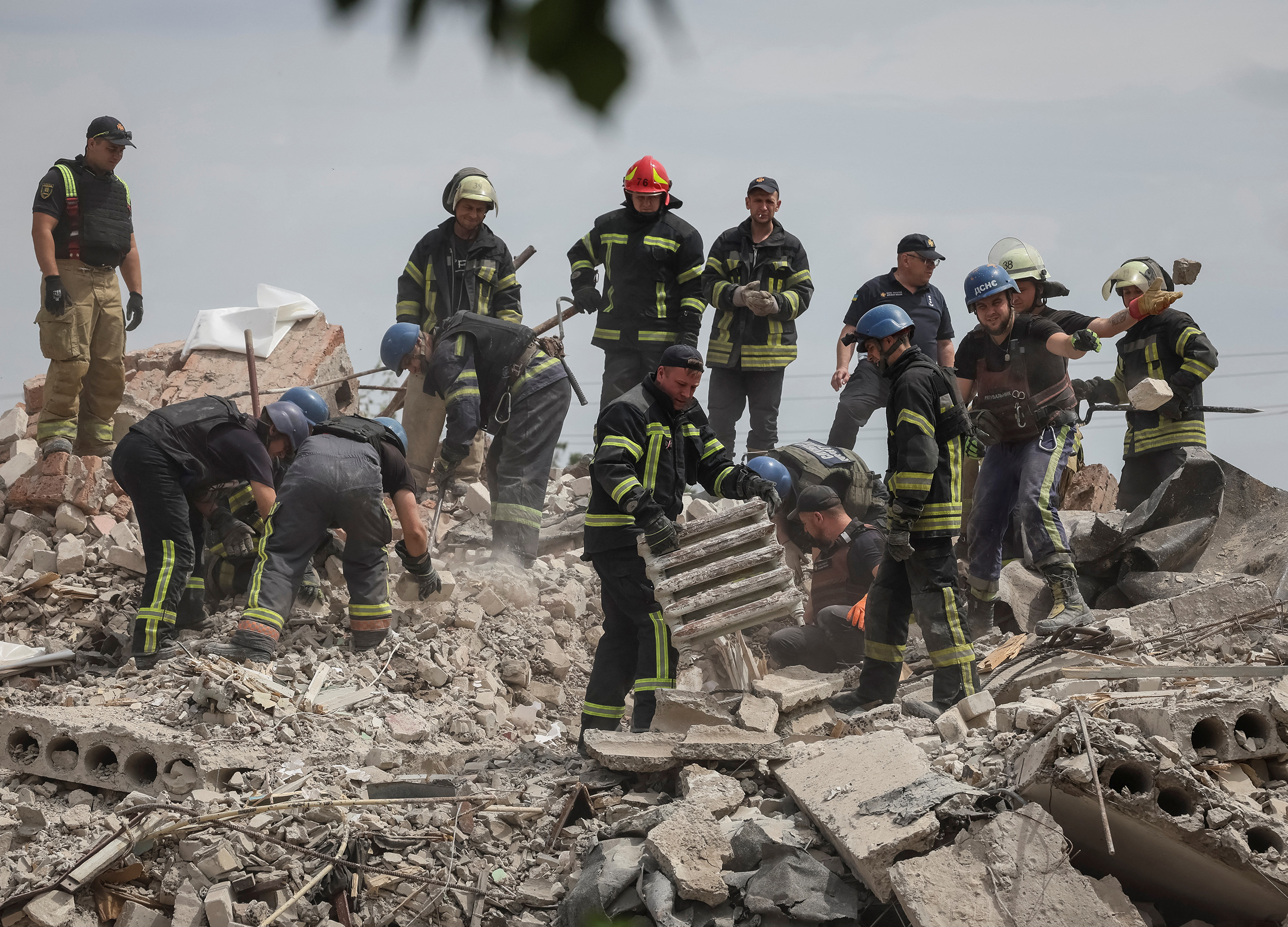 Rescuers work amid the ruins of a residential building damaged in the town of Chasiv Yar, in the Donetsk region, Ukraine, on July 10.