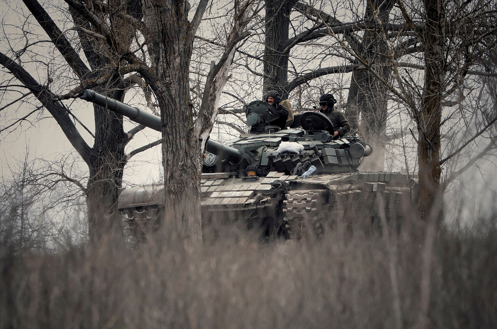 Ukrainian service members ride a tank in Donbas region, Ukraine, on April 8. 