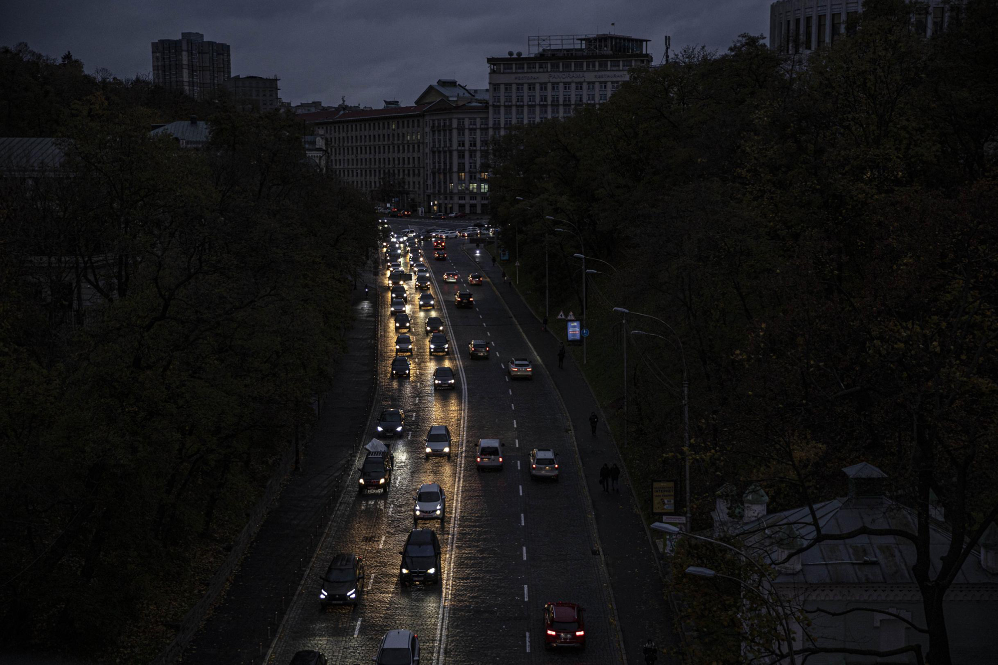 Cars move along a dark road during the energy conservation on Thursday, October 20, 2022, in Kyiv, Ukraine. 