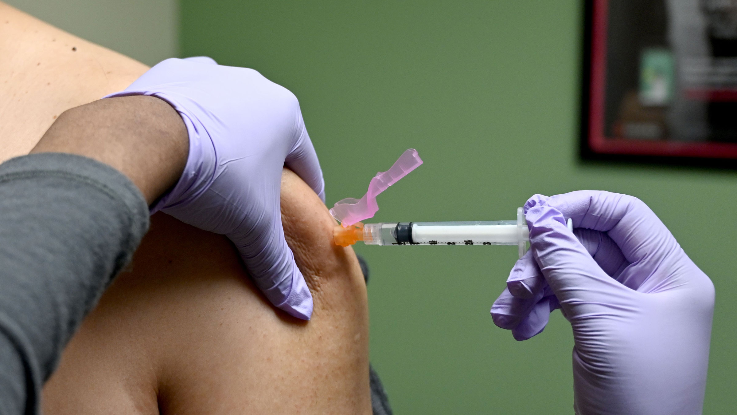 A man gets a flu shot at a health facility in Washington, DC, in January.