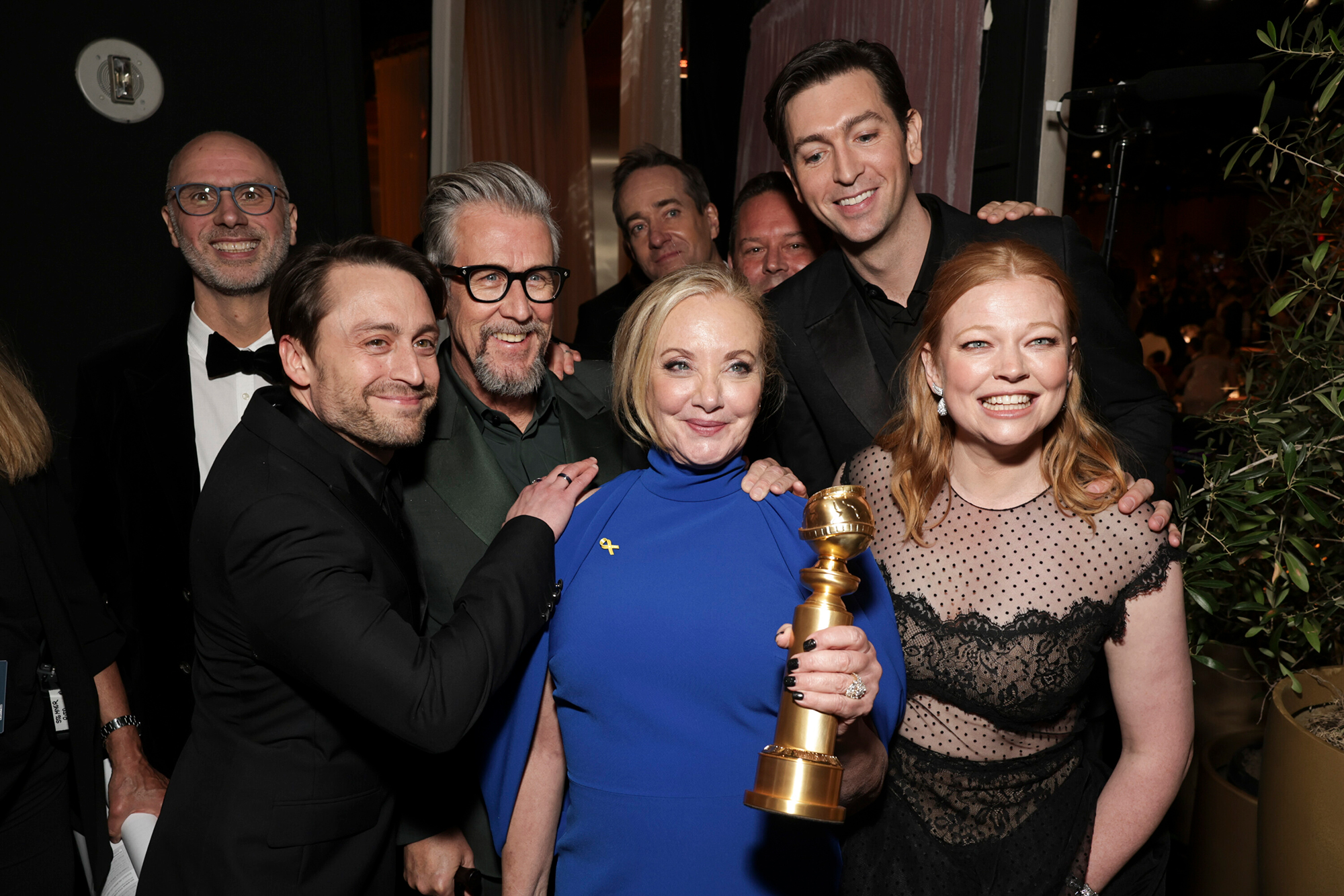 “Succession” cast members show off their Golden Globe award. 