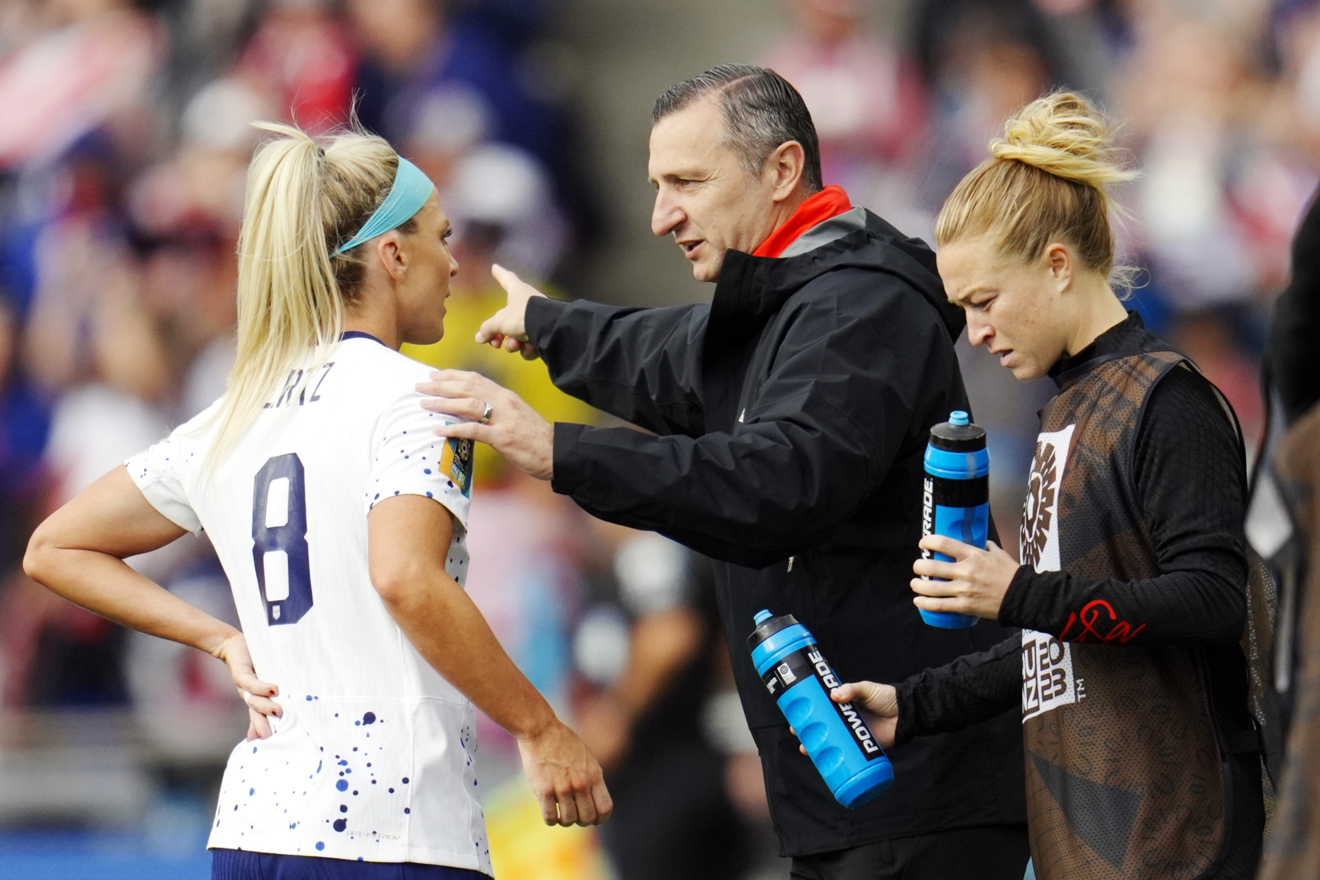 United States head coach Vlatko Andonovski, center, talks with Julie Ertz during the first half of the match between the United States and Vietnam on July 22.