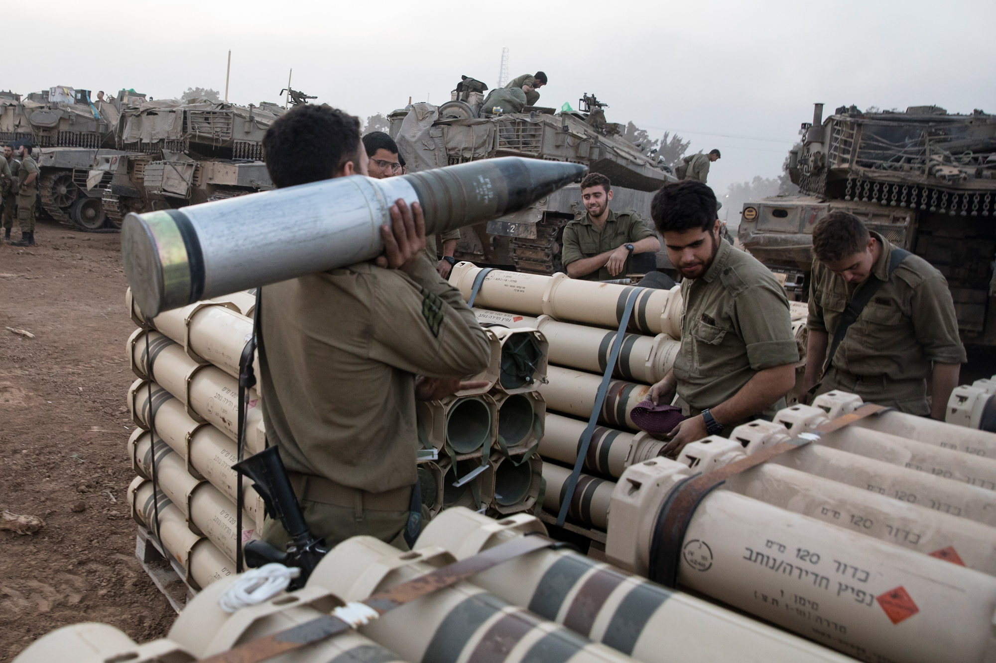 Israeli soldiers organize tank shells after returning from Gaza on January 1, on the southern border of Israel.