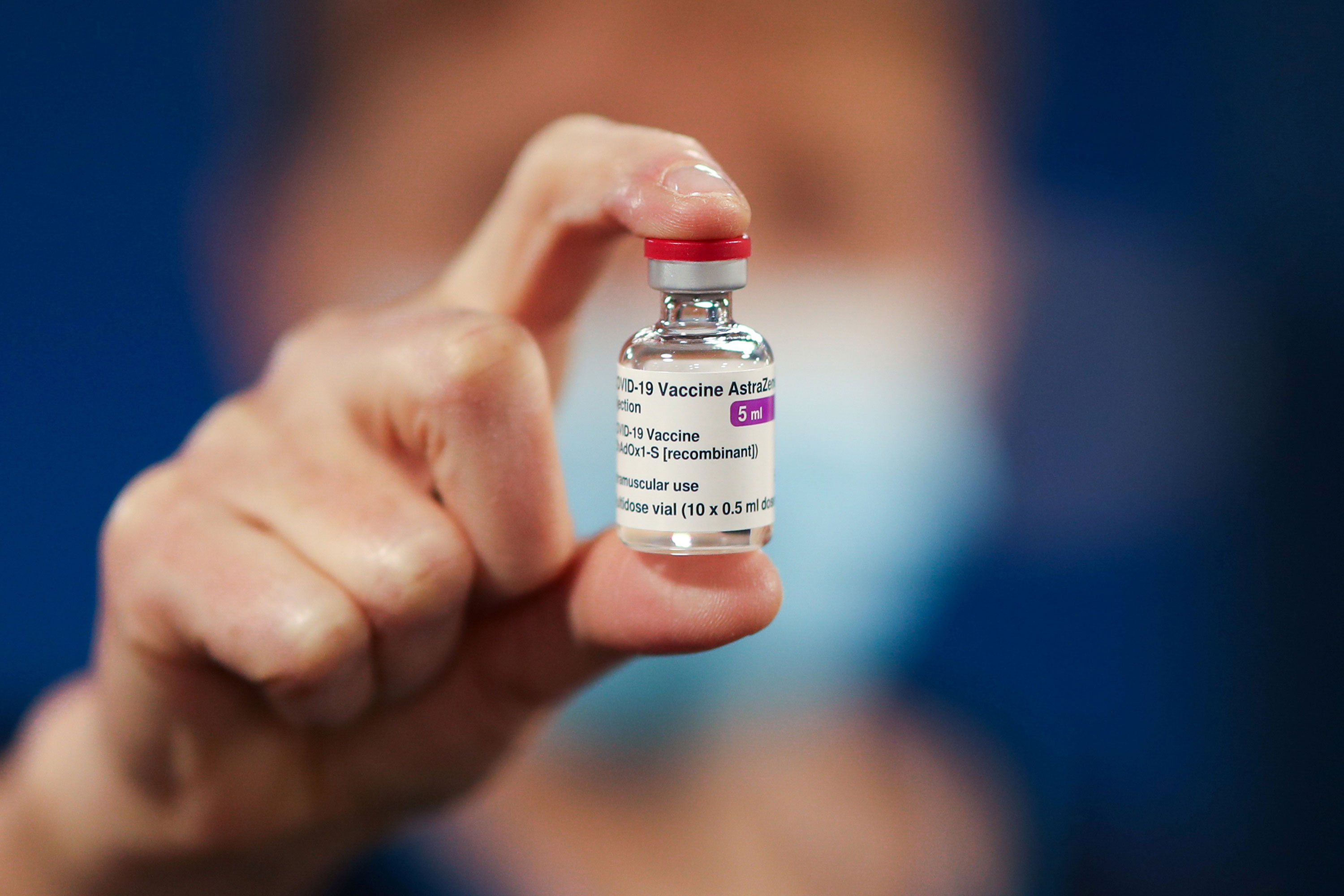 A healthcare worker holds a vial of the AstraZeneca Covid-19 vaccine on January 7 in Currie, Scotland.