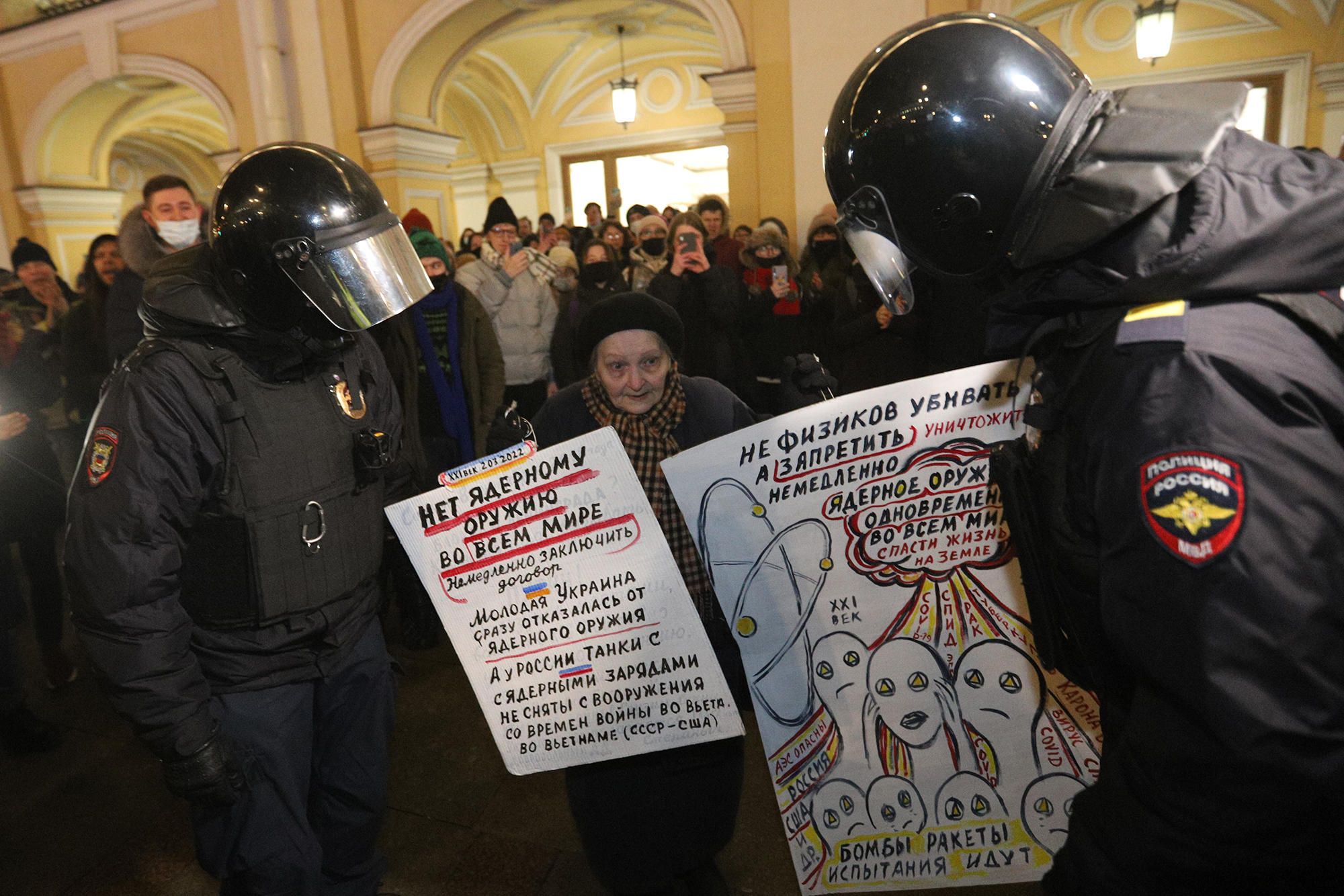 Security forces intervene with anti-war protesters in Saint-Petersburg, Russia, on March 2.