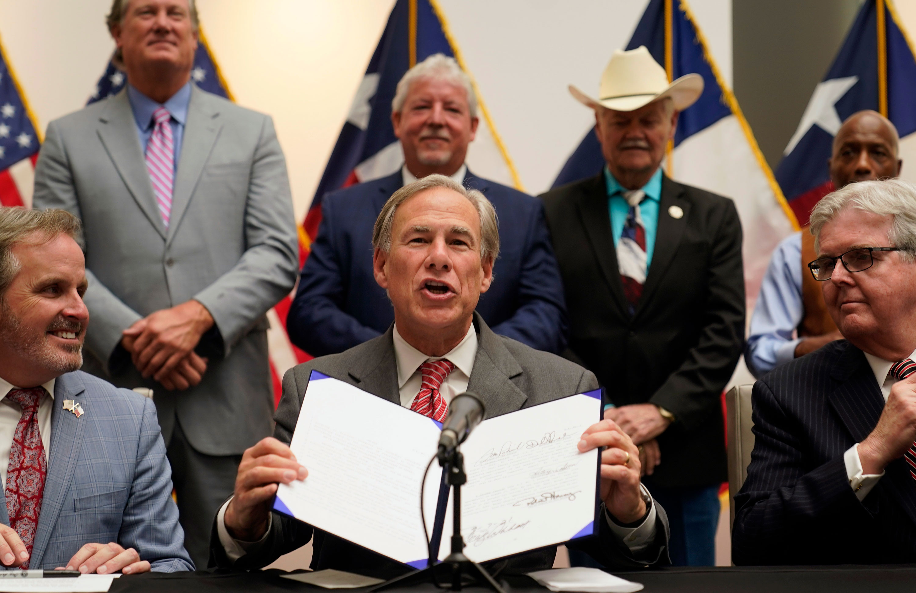 Texas Gov.  Greg Abbott speaks after signing Senate Bill 1 into law in Tyler, Texas, on September 7.
