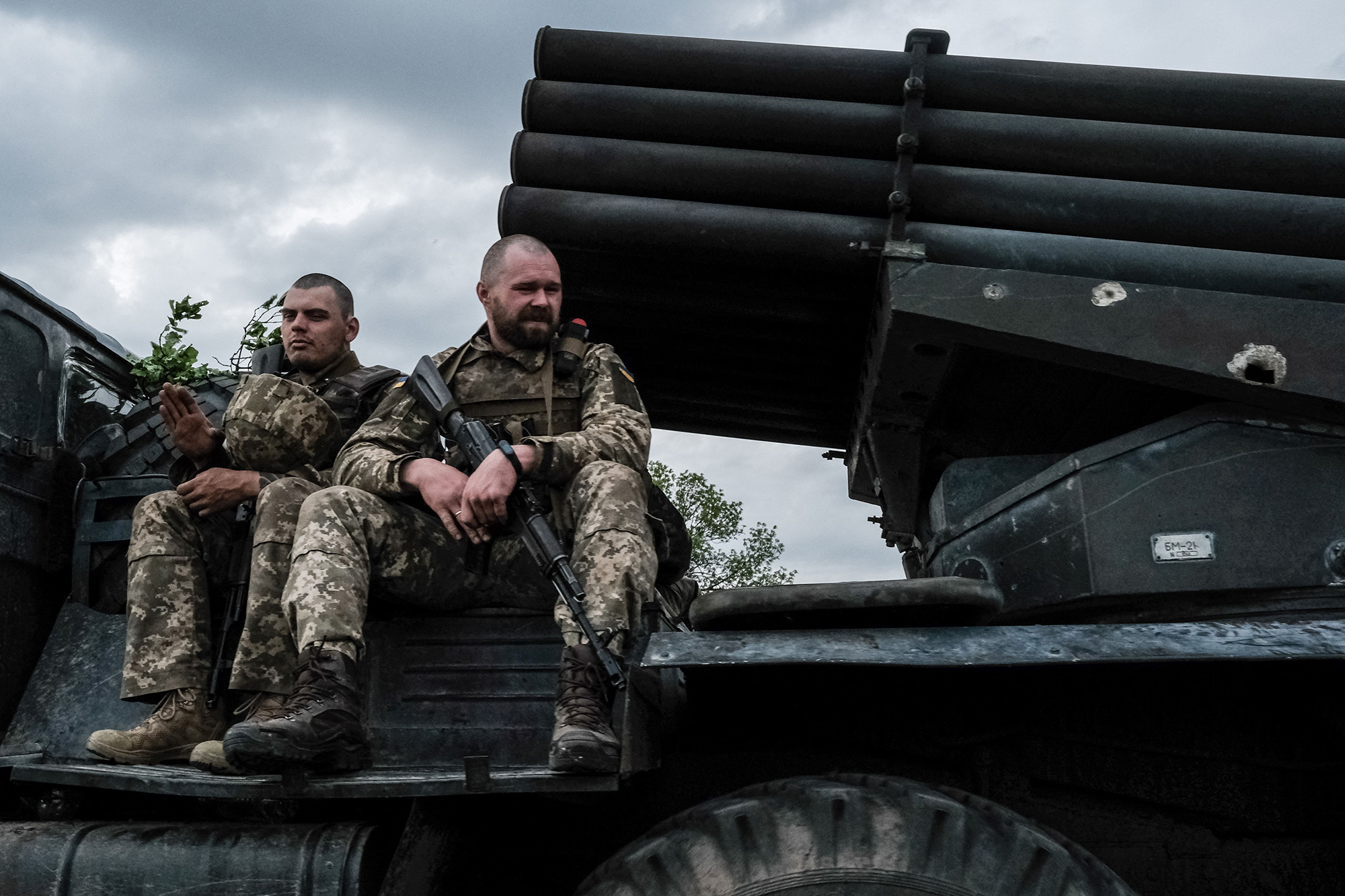 Ukrainian soldiers ride on a moving truck-mounted multiple rocket launcher near Lysychansk, eastern Ukraine, on May 13.