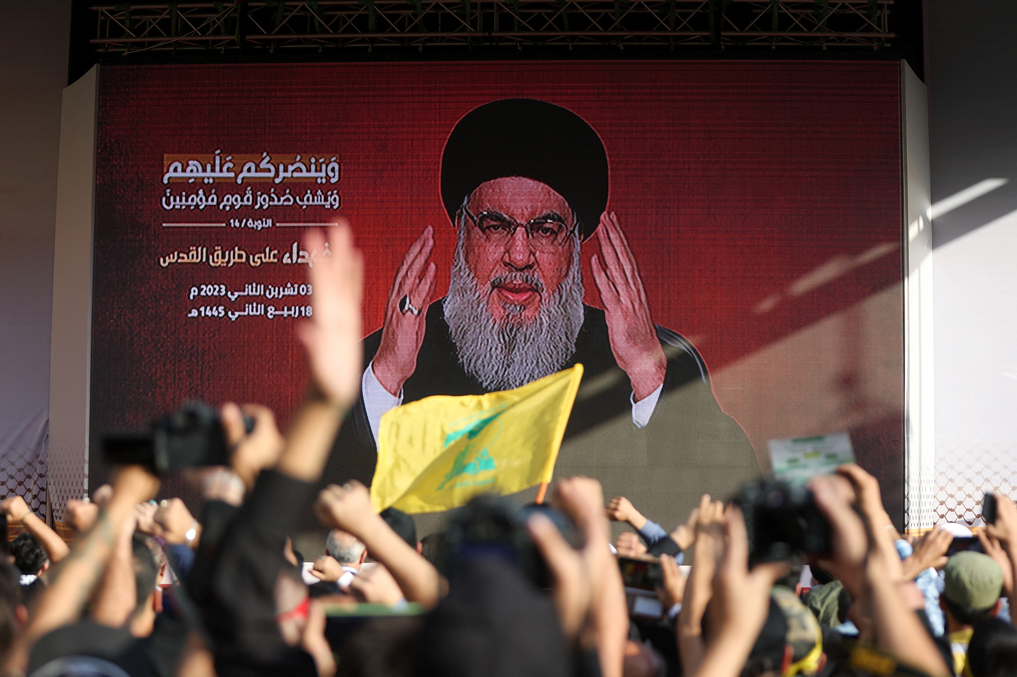 Lebanon's Hezbollah leader Sayyed Hassan Nasrallah appears on a screen as he addresses his supporters in Beirut, Lebanon, on November 3.