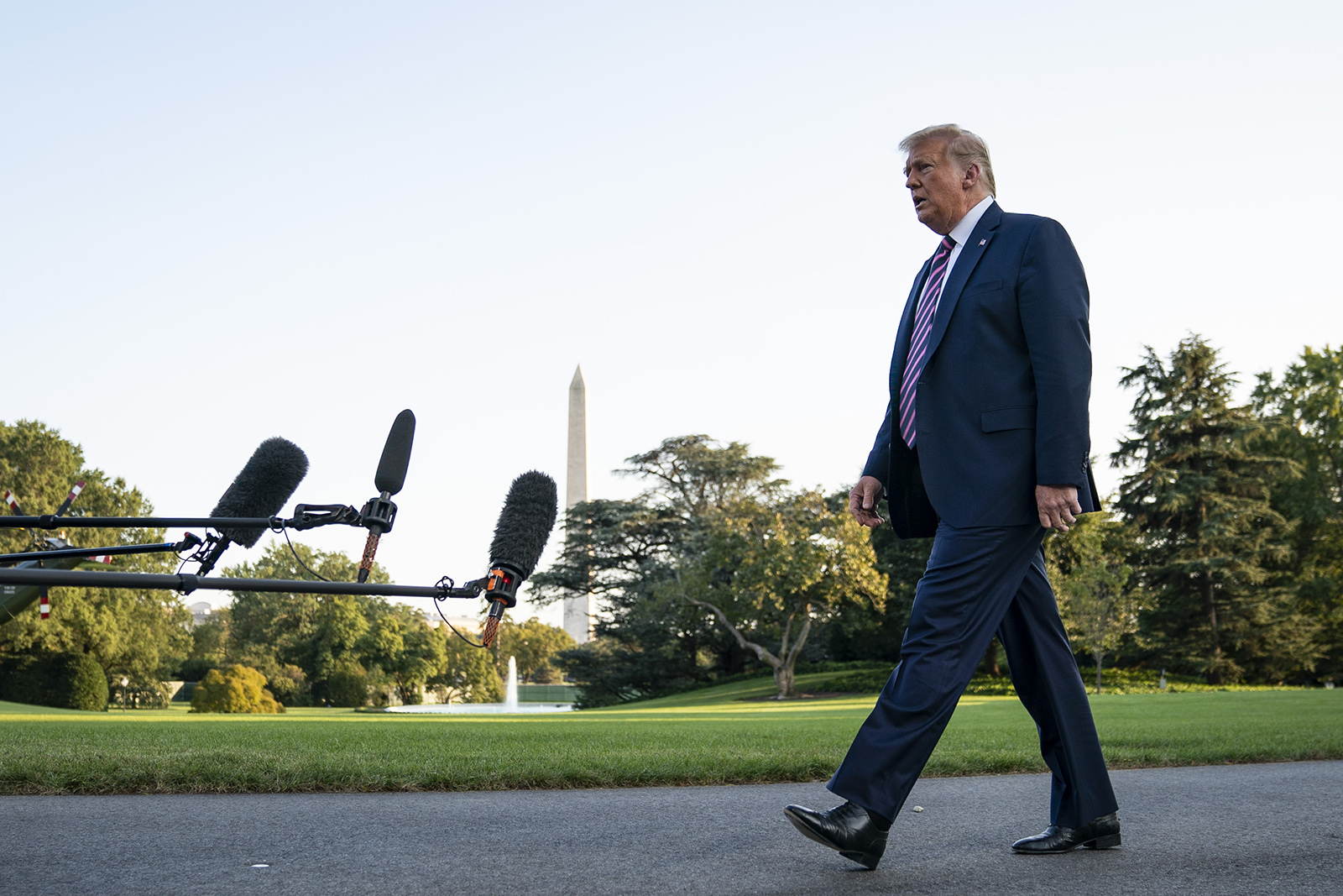 President Donald Trump stops and takes questions from reporters on his way to Marine One on the South Lawn of the White House on September 22, in Washington.