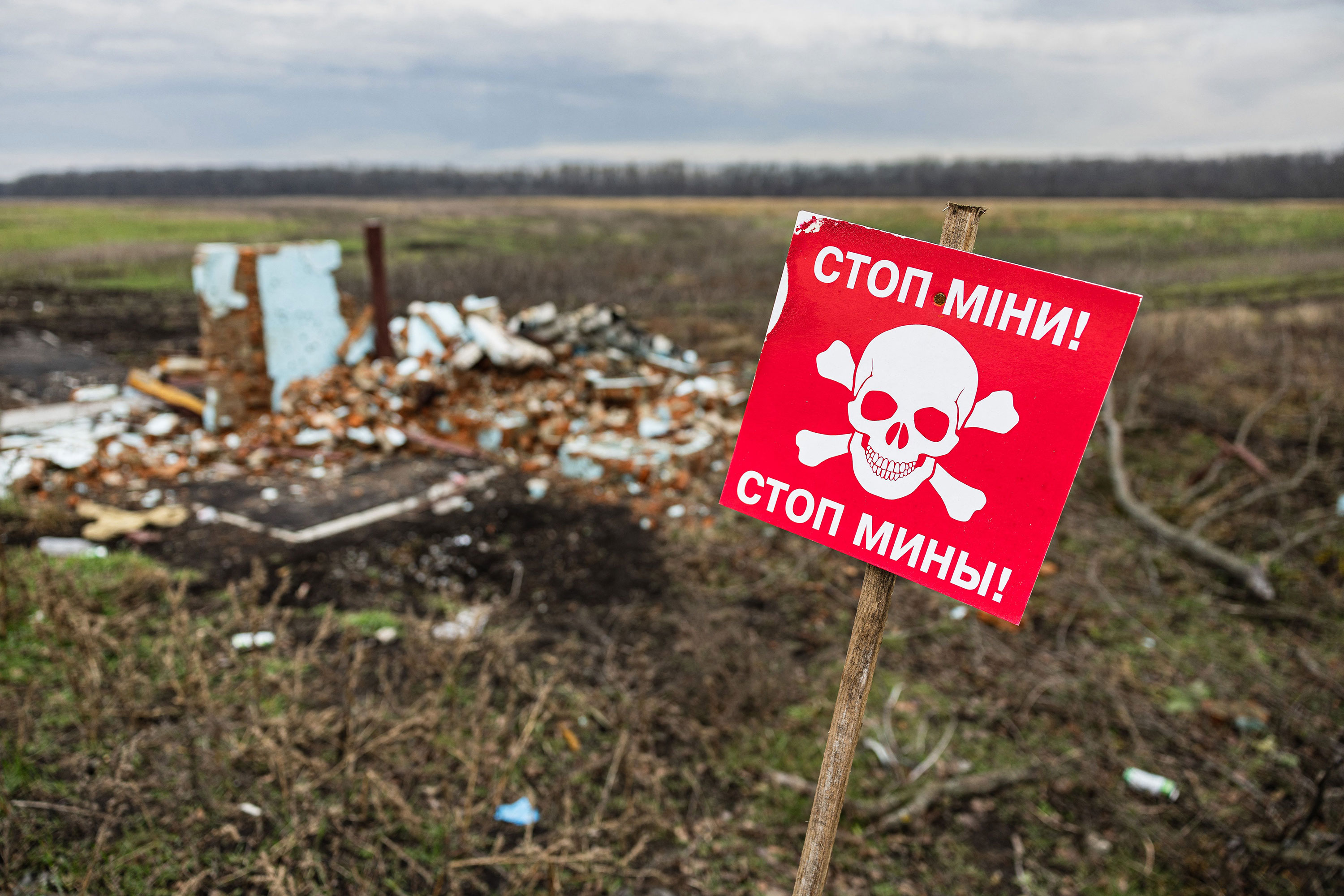 A sign, written in Ukrainian and Russian, warns of mines in the Donetsk region of eastern Ukraine on January 2. 