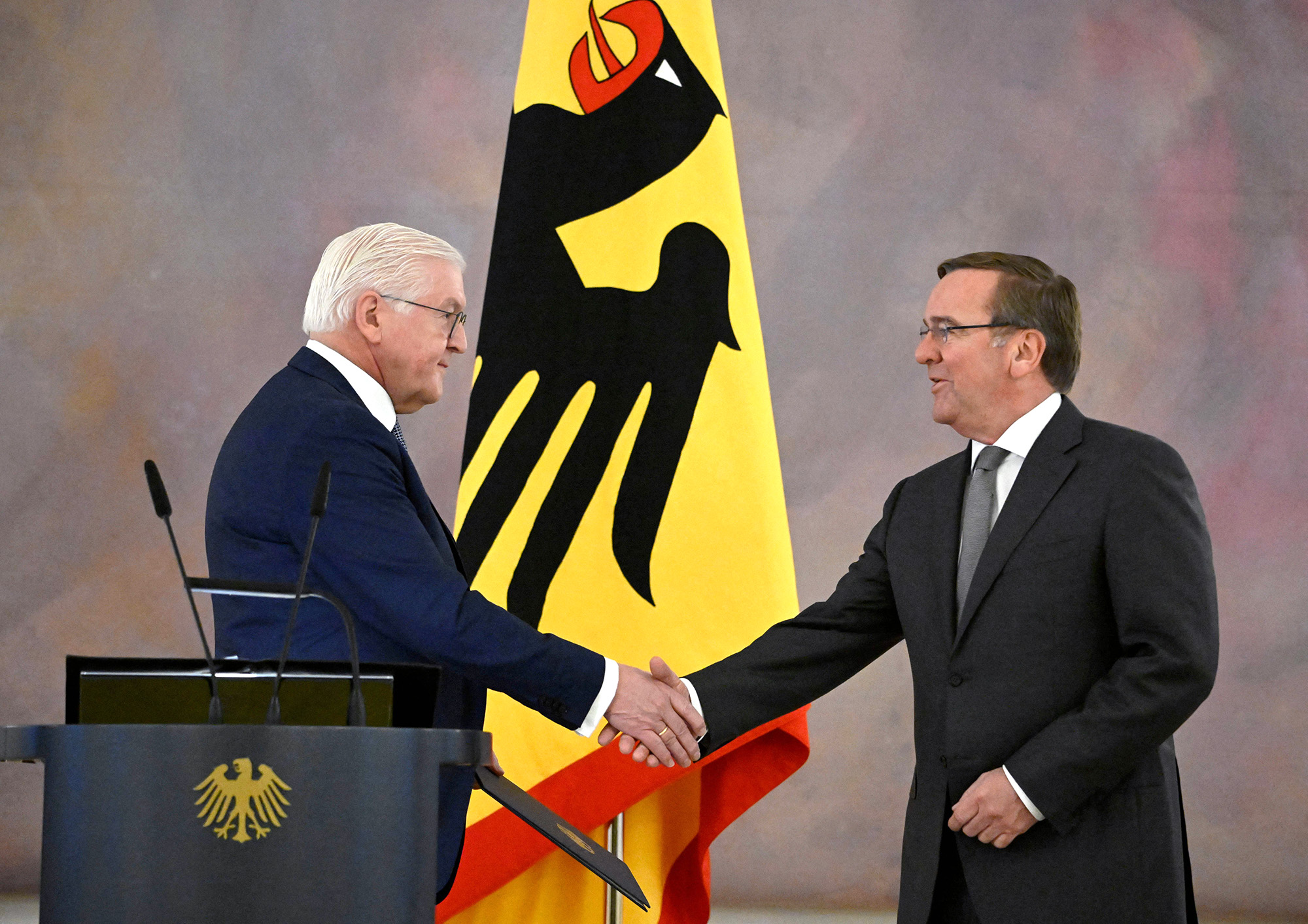 German President Frank-Walter Steinmeier, left, shakes hands with Germany's new Defense Minister Boris Pistorius as he hands him over the certificate of appointment at the presidential Bellevue Palace in Berlin on January 19.