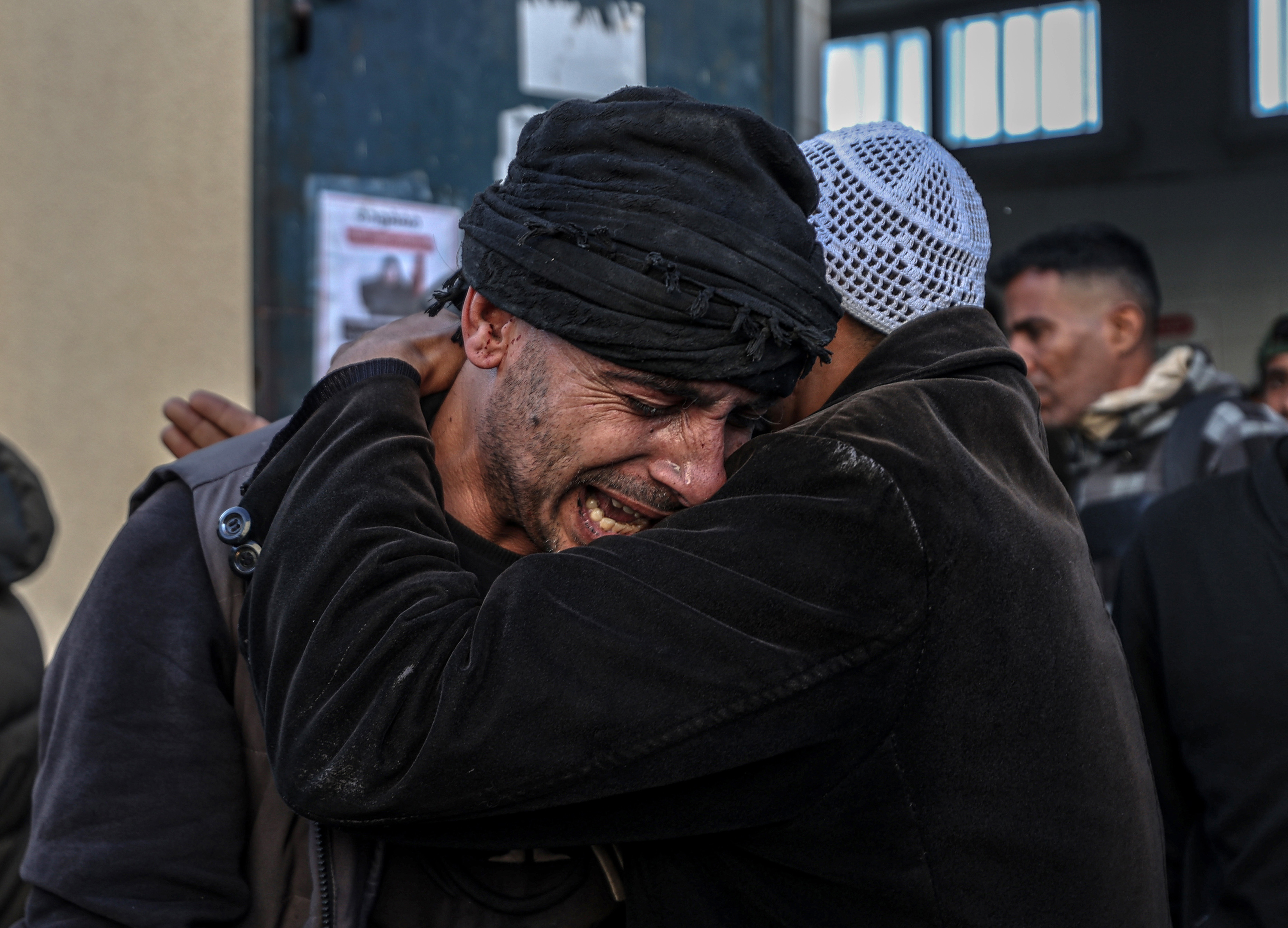 Members of a family whose child was killed by an Israeli attack on Nuseirat camp mourn as the child's lifeless body is brought to Al-Aqsa Martyrs Hospital in Deir al Balah, Gaza on February 17.