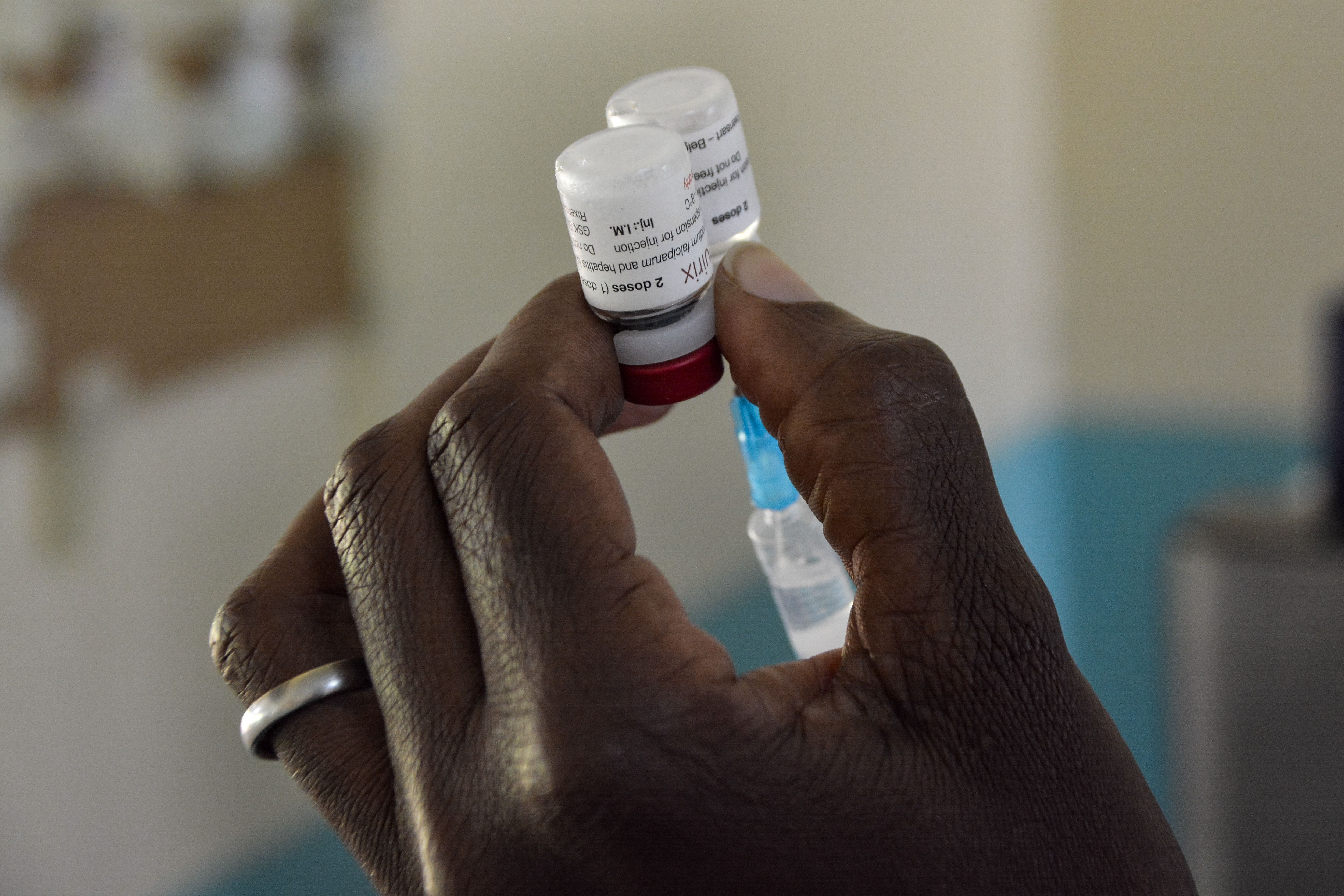 A health worker prepares a malaria vaccination for a child at Yala Sub-County hospital, in Yala, Kenya, on October 7th, 2021