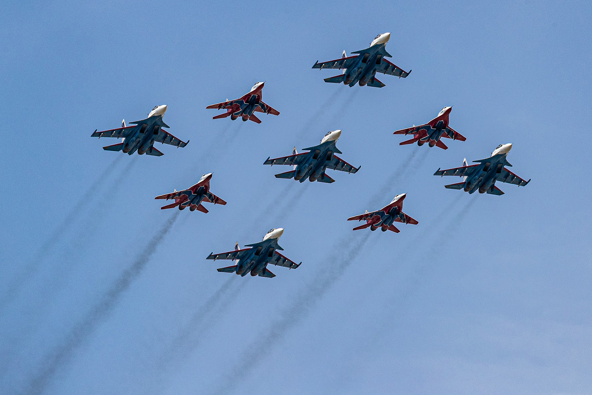 MiG-29 jet fighters of the Strizhi Swifts and Su-30SM jet fighters of the Russkiye Vityazi, Russian Knights, aerobatic teams take part in a rehearsal for the Victory Day parade in Moscow, Russia, on May 7.