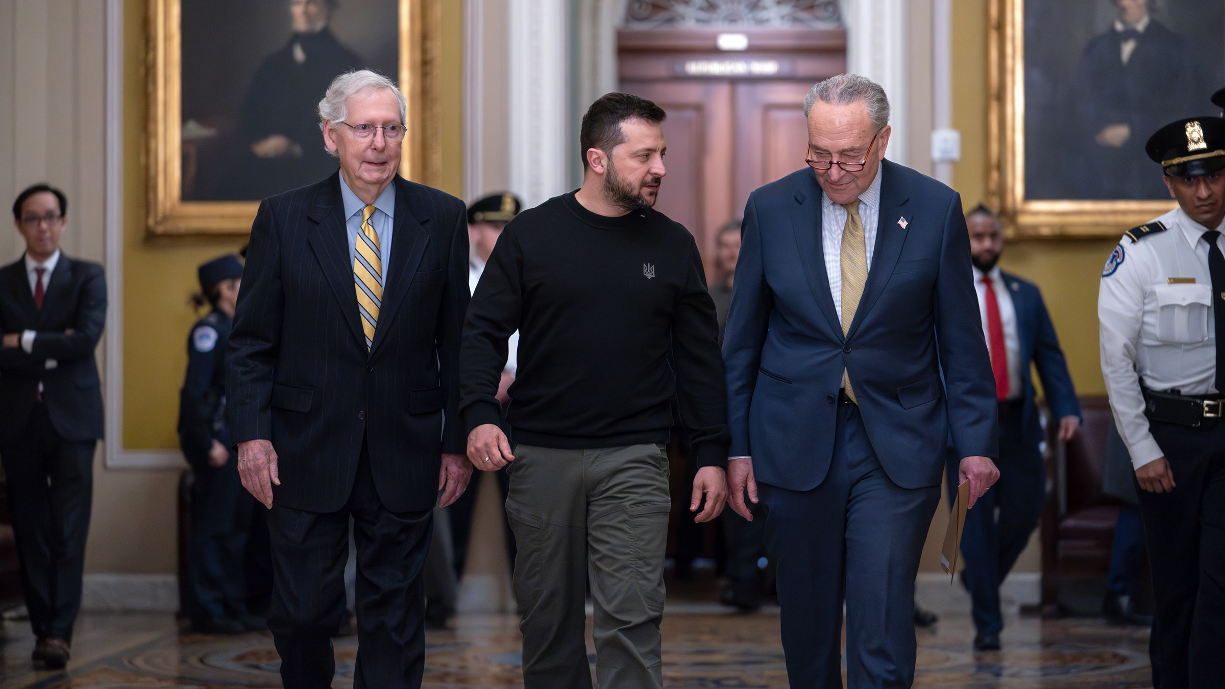 Ukrainian President Volodymyr Zelensky, center, is escorted by Senate Minority Leader Mitch McConnell, left, and Senate Majority Leader Chuck Schumer on Tuesday.