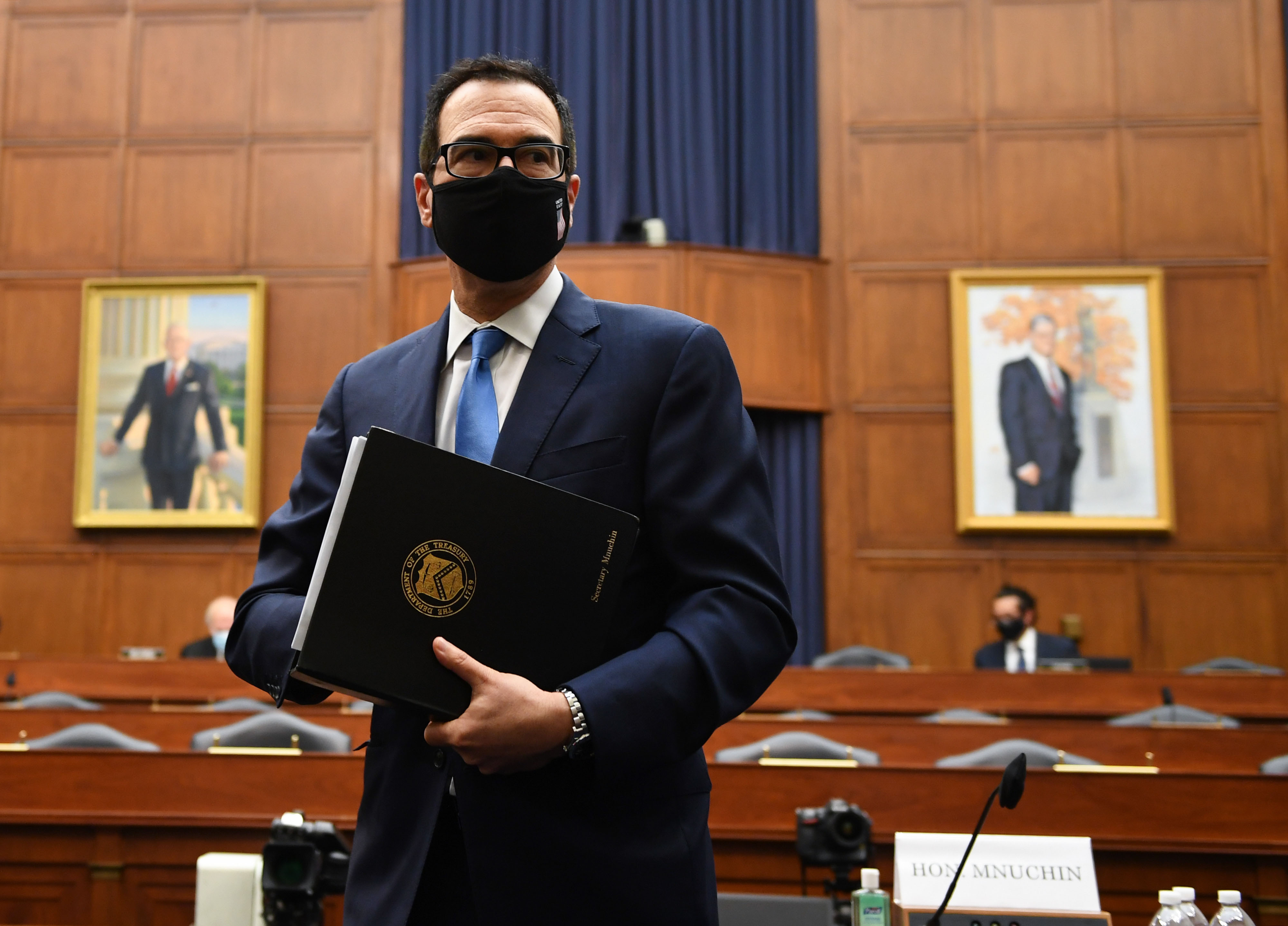 Treasury Secretary Steven Mnuchin stands after testifying in Washington, DC, on July 17.