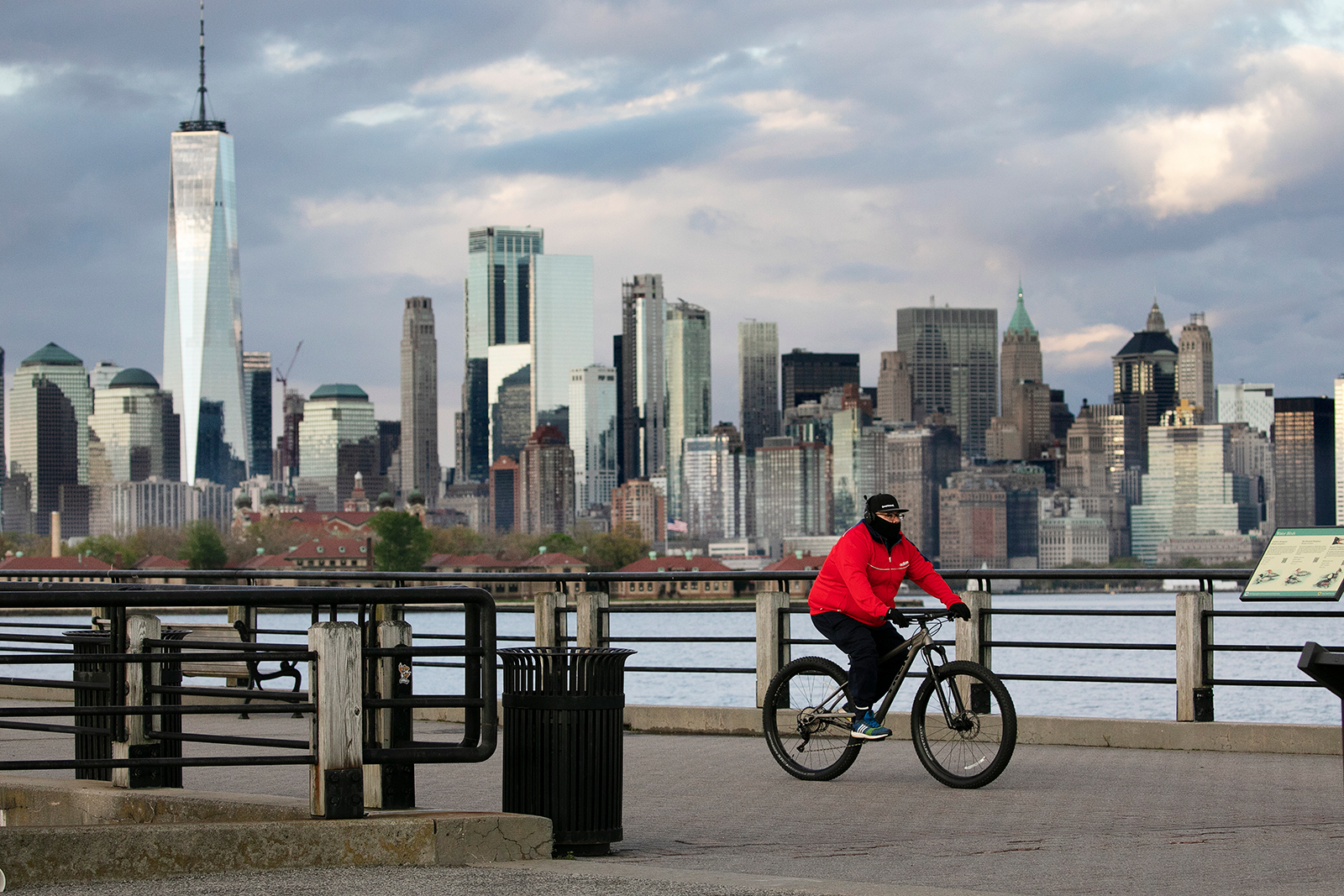 A cyclist wears a mask as he bikes in Liberty State Park, on May 11, in Jersey City, New Jersey.