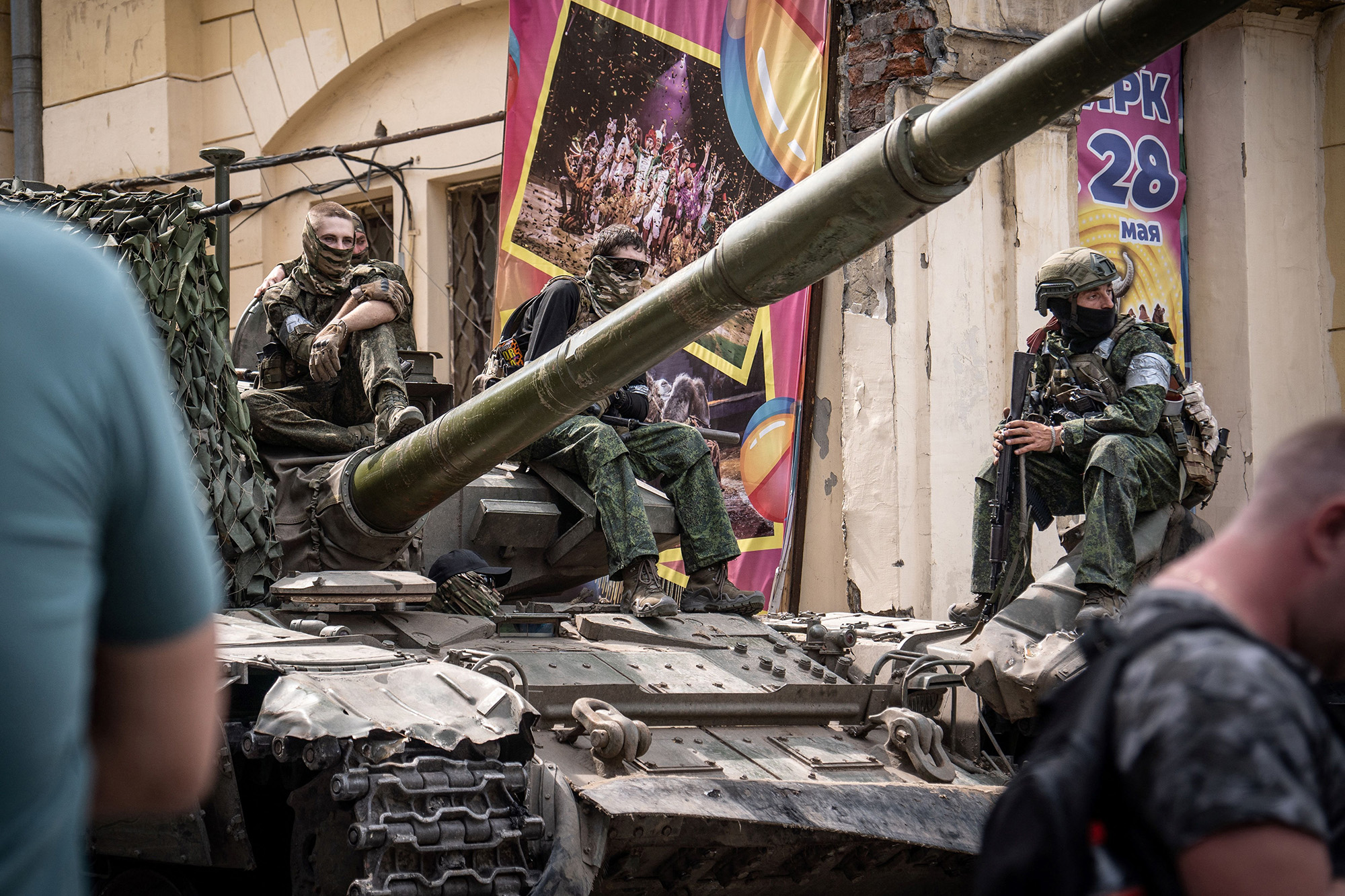 Members of Wagner group sit atop of a tank in a street in the city of Rostov-on-Don, on June 24.