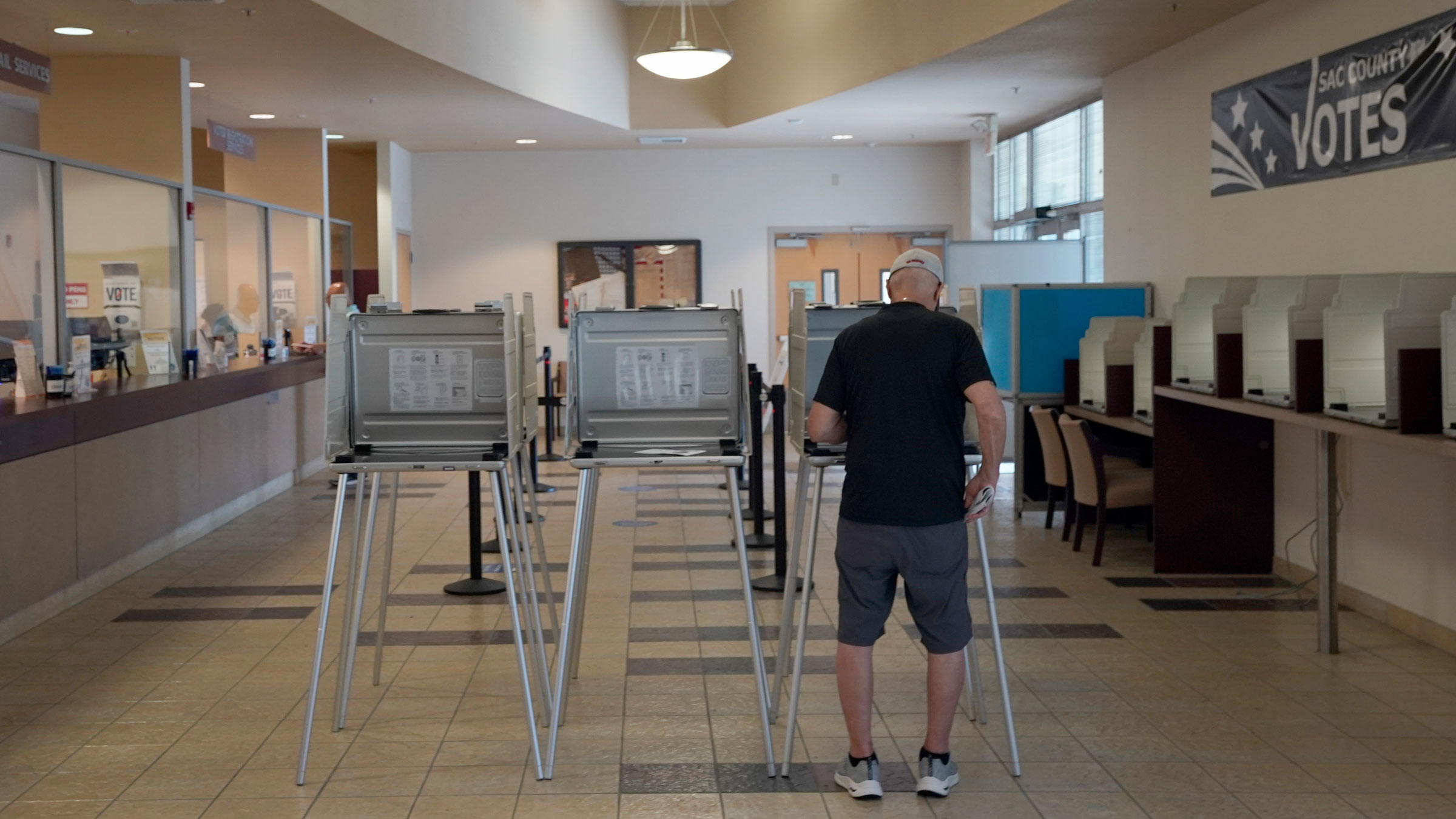 Robert Macias marks his ballot in Sacramento, California, on Tuesday.