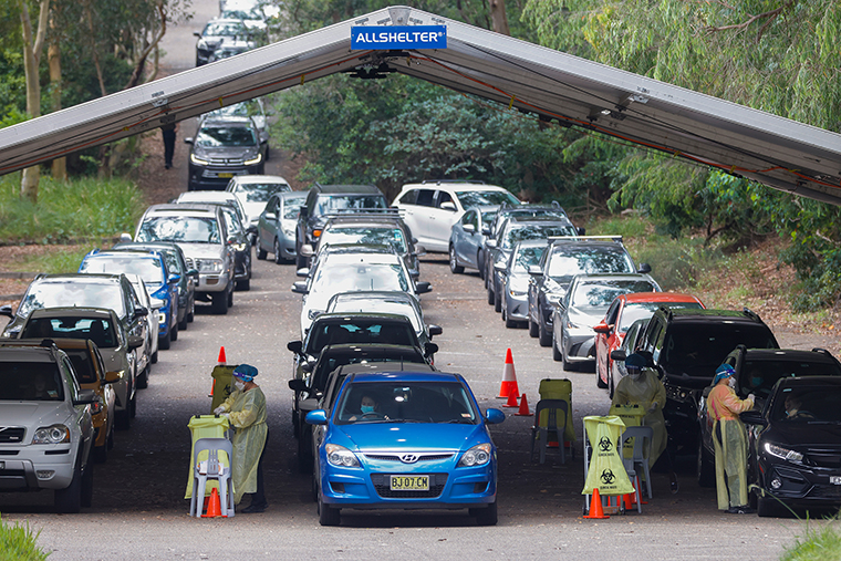 Cars line up at the Warringah Aquatic Centre Histopath Pathology Covid-19 drive-through testing clinic on January 10, in Sydney, Australia. 