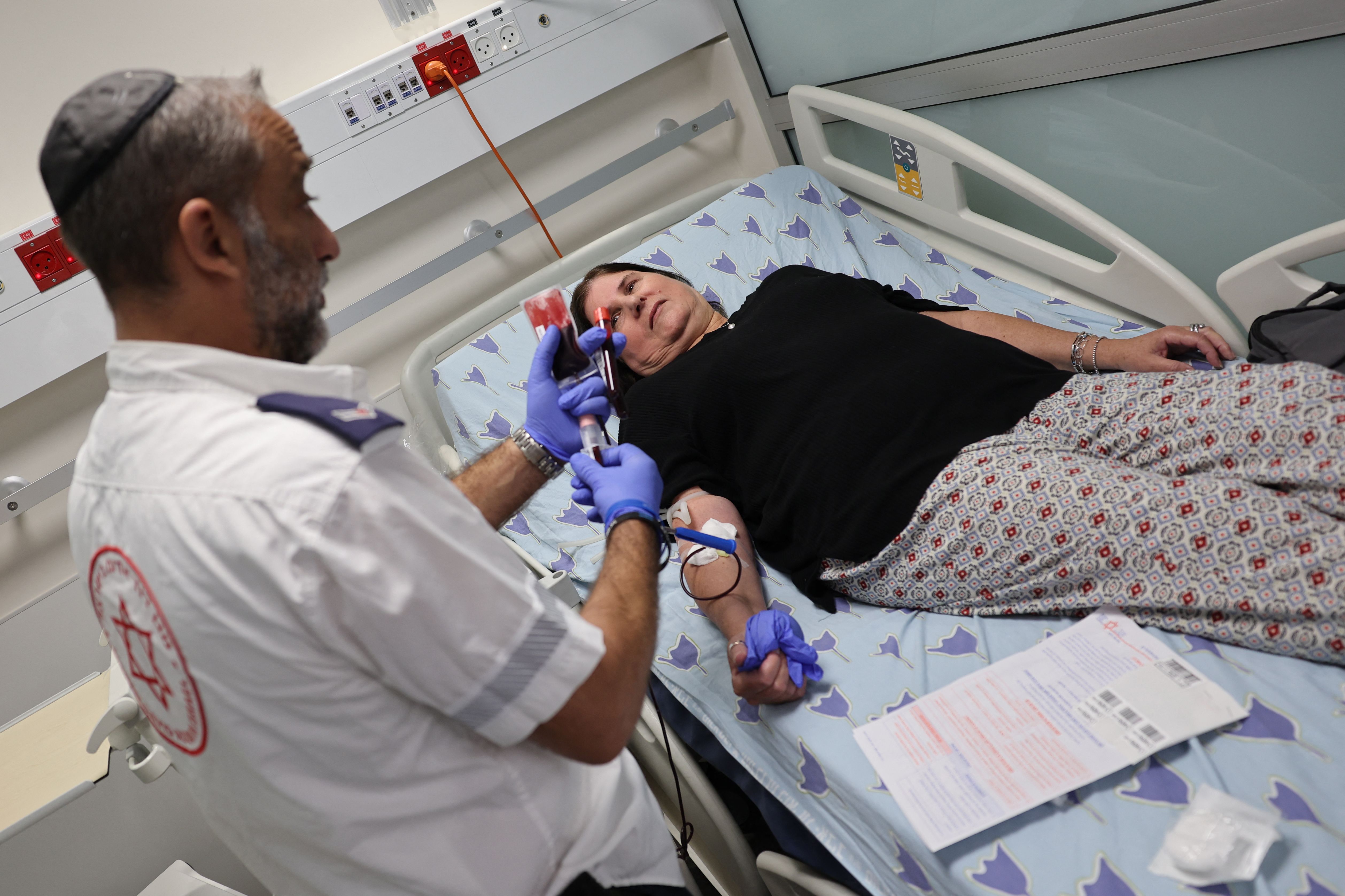 An Israeli woman donates blood at a hospital in Tel Aviv, Israel, on October 7, 2023.