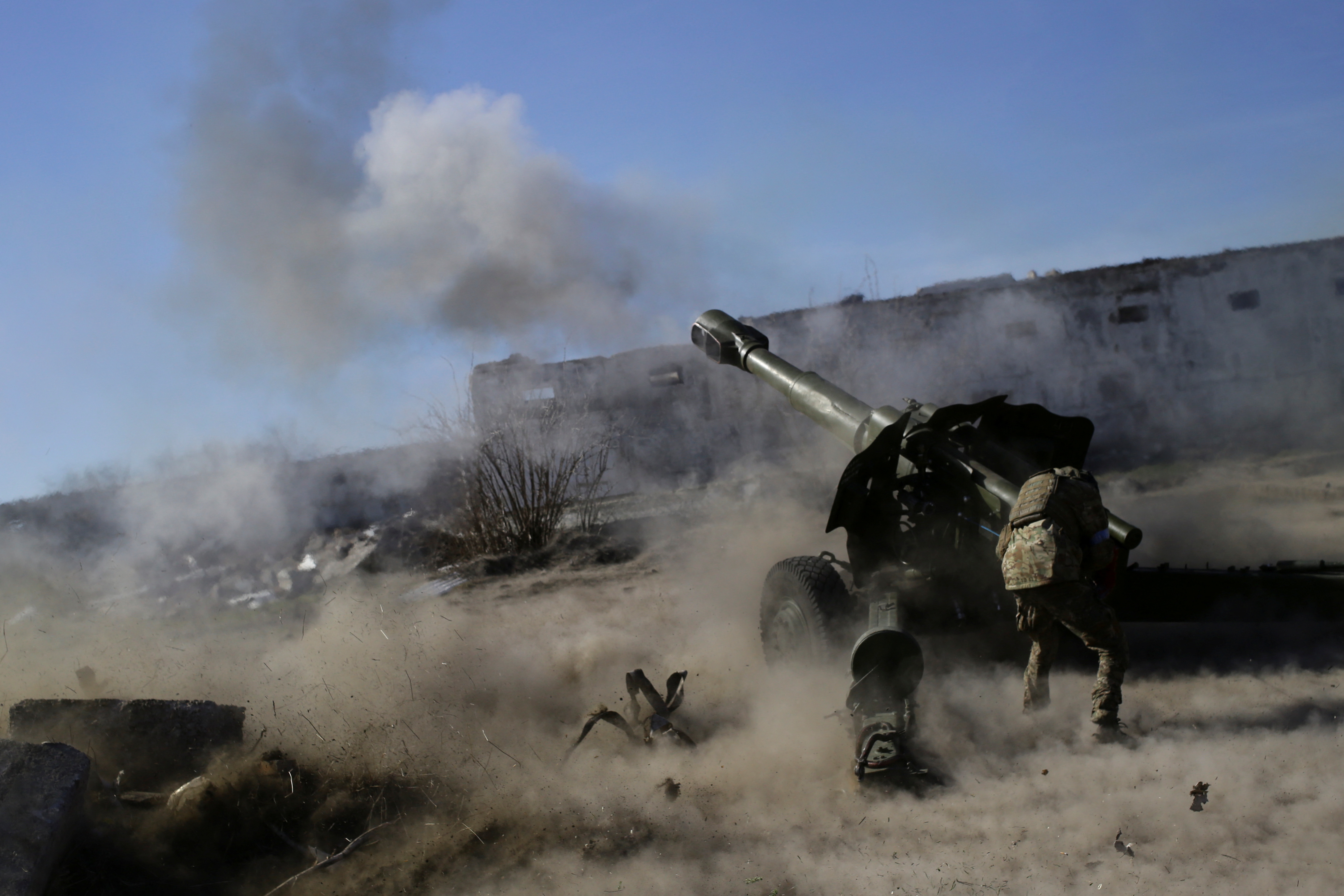 A member of the Ukrainian Volunteer Corps fires with a howitzer at a position in the Zaporizhzhia region of Ukraine, on March 28.