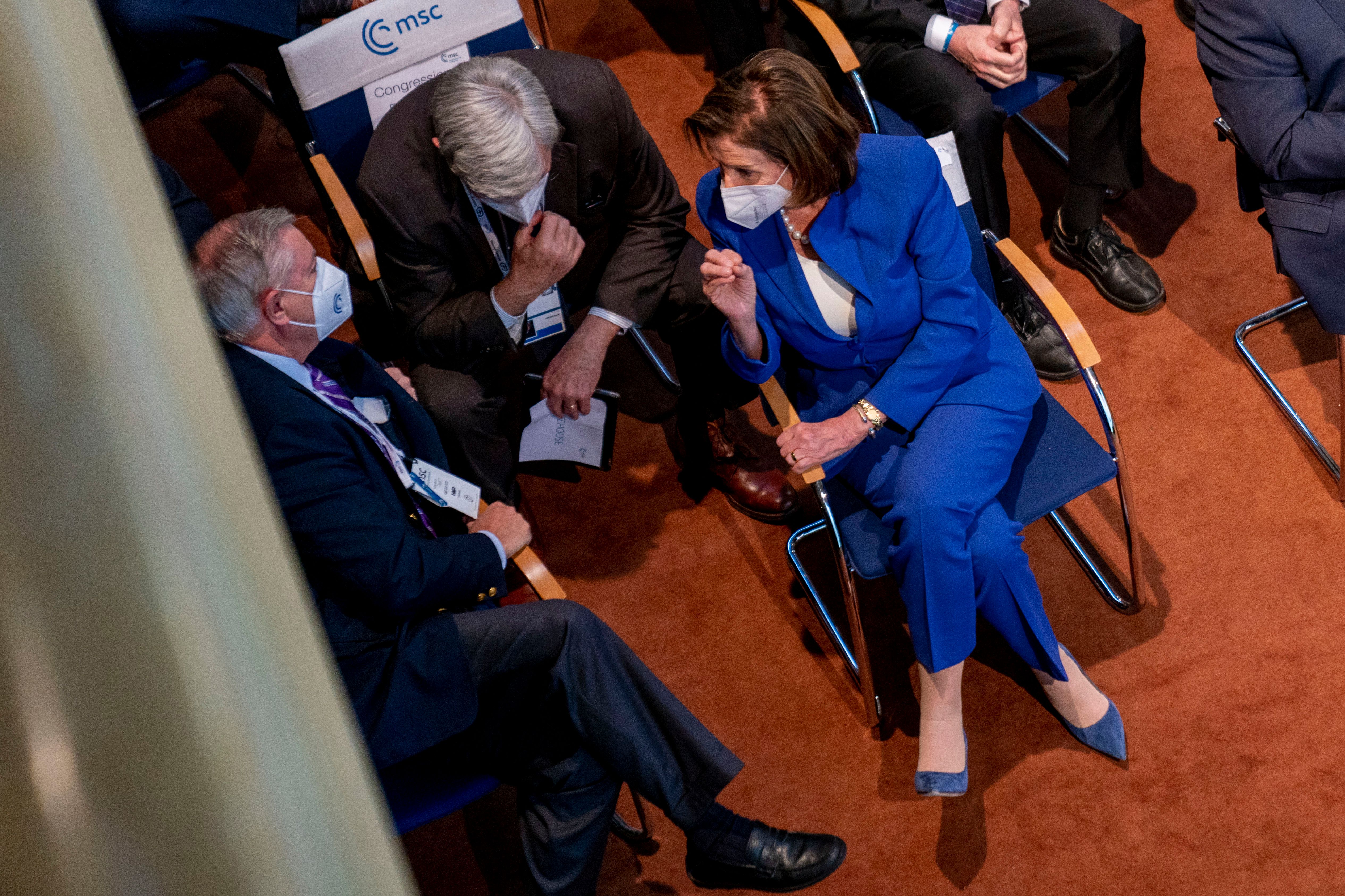 House Speaker Nancy Pelosi talks with Sen. Lindsey Graham (R-SC), left, and Sen. Sheldon Whitehouse (D-RI), center, at the Munich Security Conference in Germany, on February 19. 