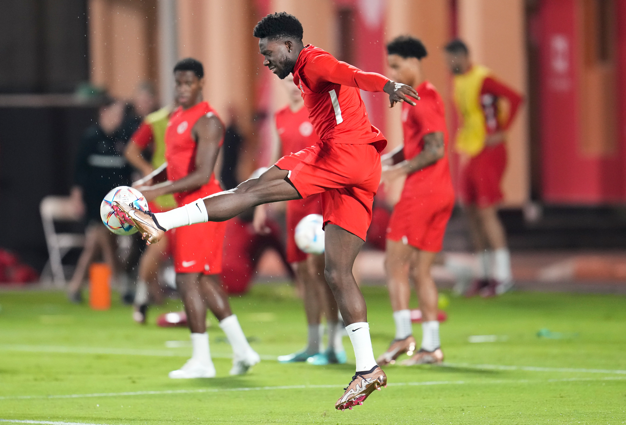 Canada forward Alphonso Davies kicks the ball during practice at the World Cup in Doha on Tuesday.