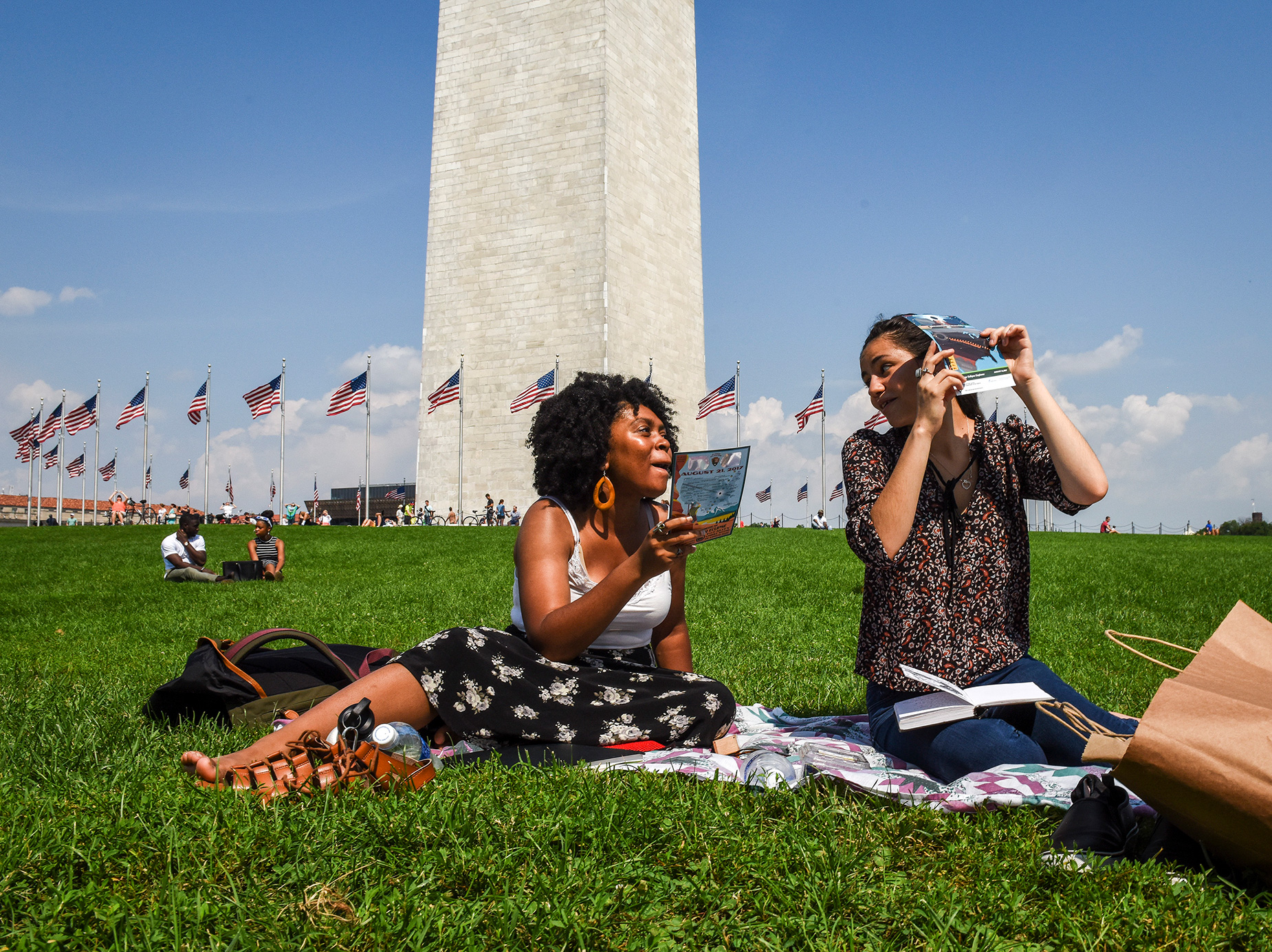 Native Washingtonians Autumn Spears, left, and Alice Kostovisky catch the solar eclipse in Washington DC, on August, 21, 2017.