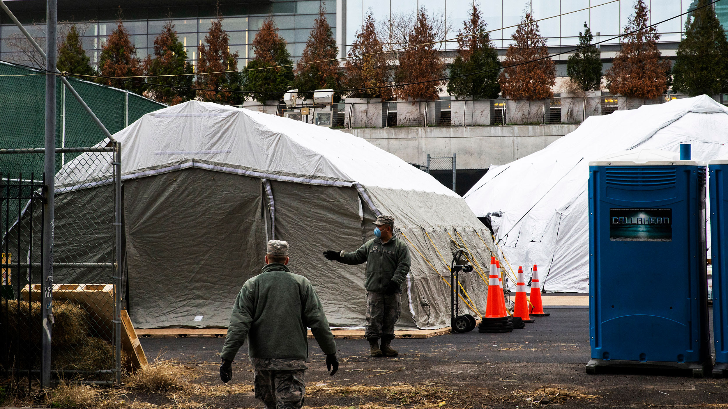 Workers and military personnel build a makeshift morgue outside of Bellevue Hospital on March 25