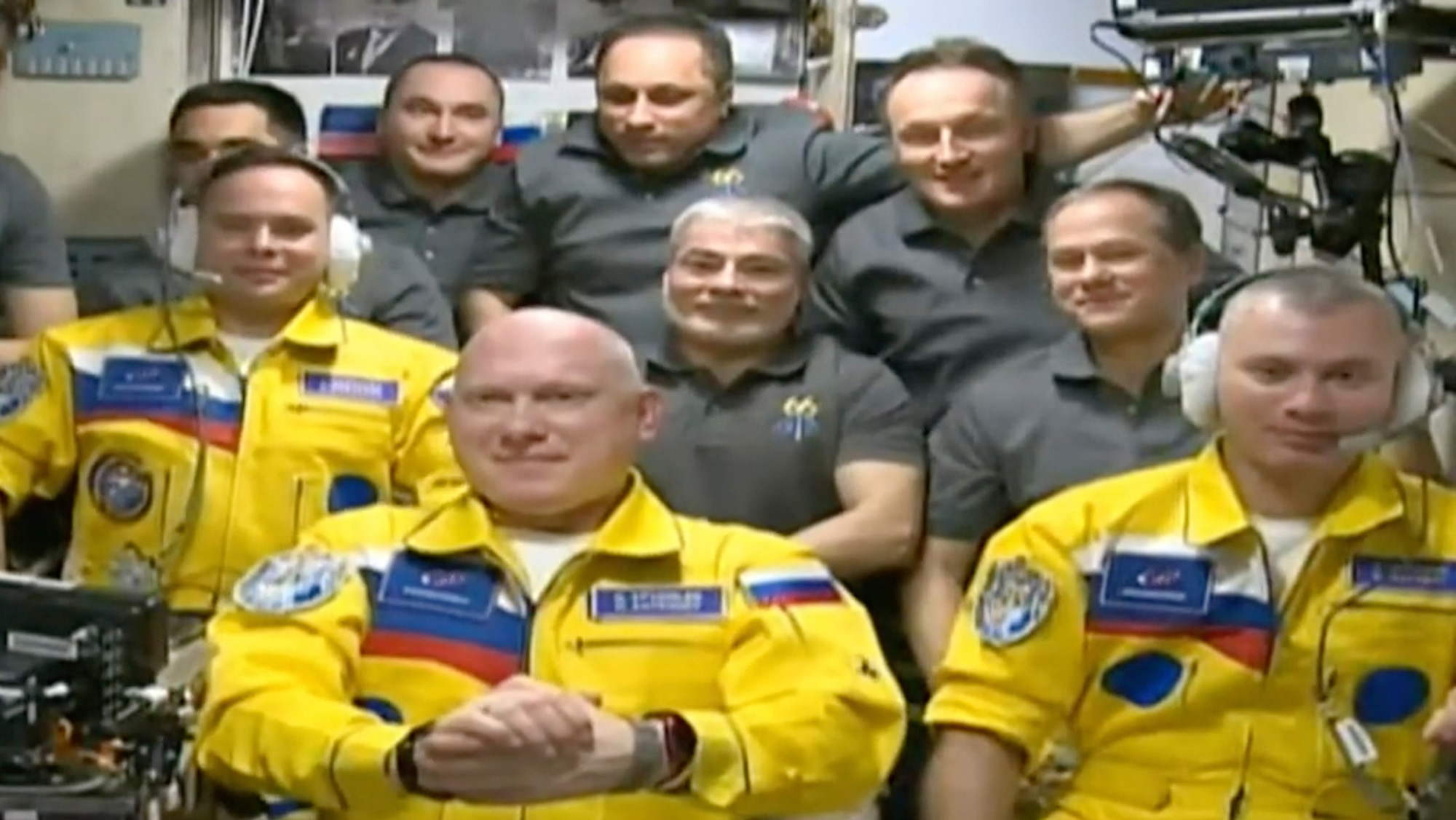 Russian cosmonauts arrived at the International Space Station in yellow and blue, sparking speculation