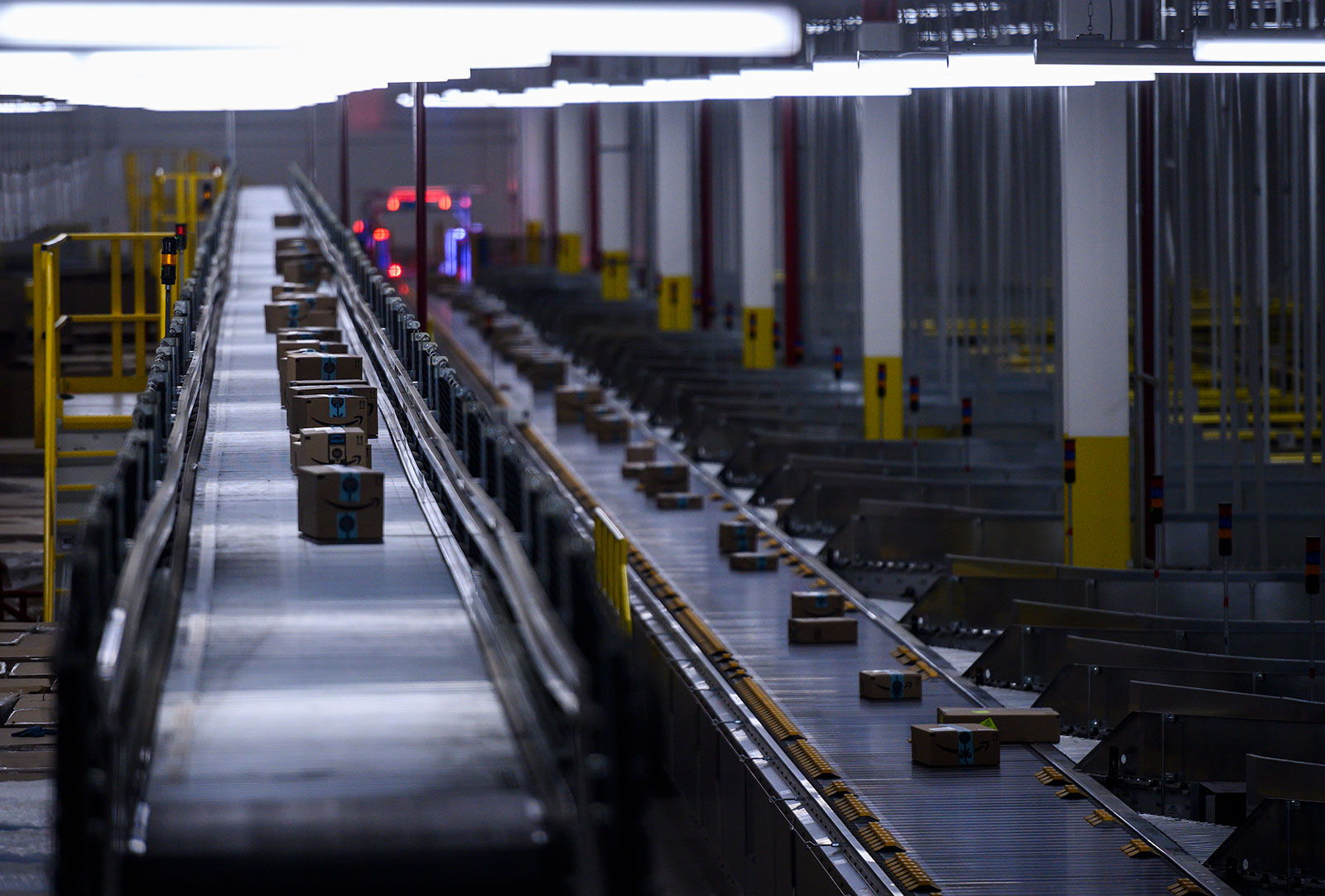Orders move down a conveyor belt at the Amazon fulfillment center in Staten Island, New York. On Tuesday the company confirmed the death of an employee who worked at the facility.