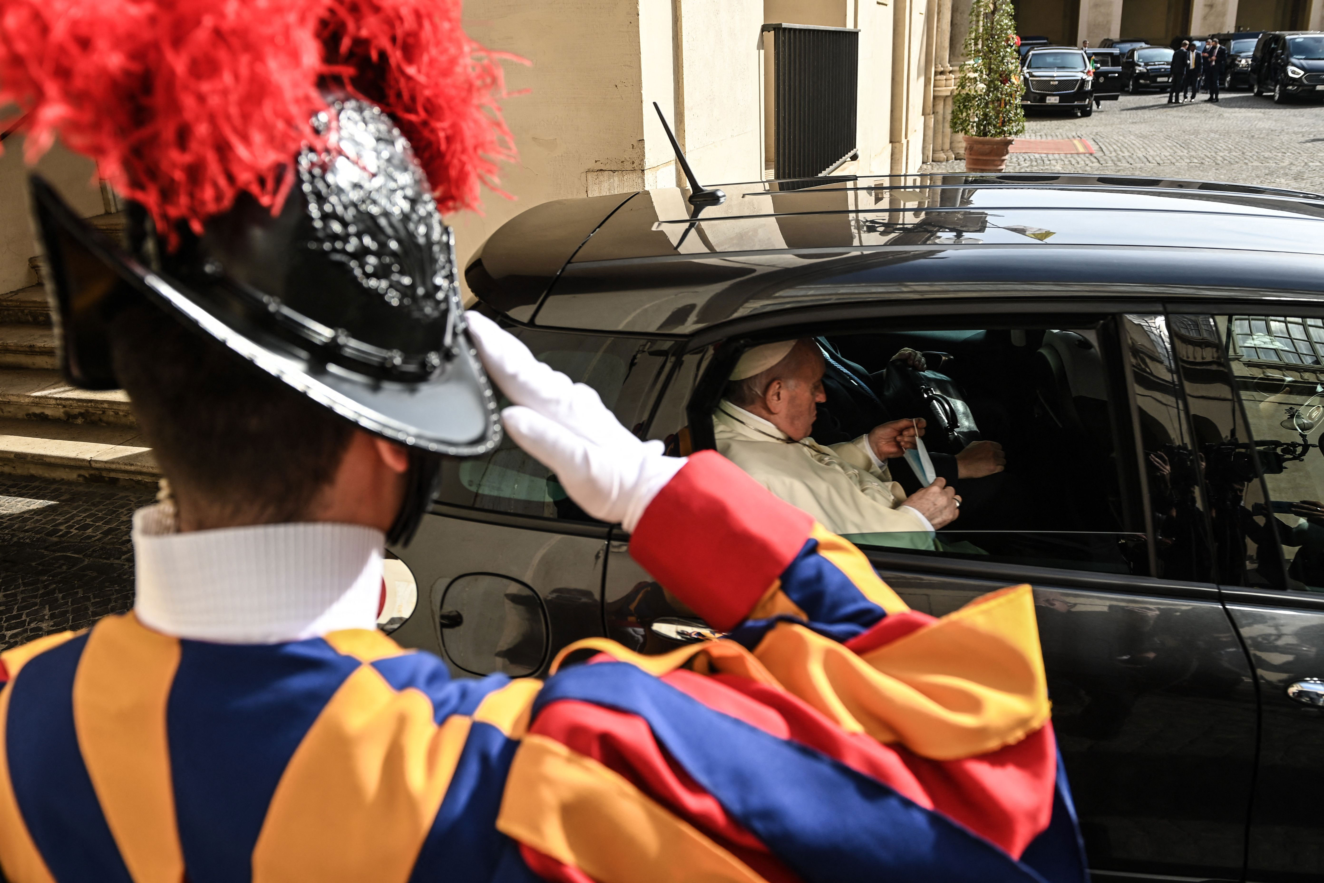 Pope Francis leaves in a car following a private audience with President Joe Biden at the Vatican on October 29.