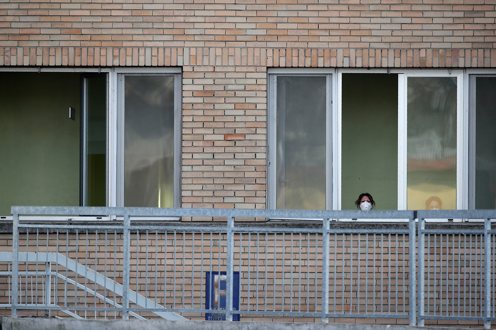 A nurse looks out the window of a hospital in Codogno on Friday.