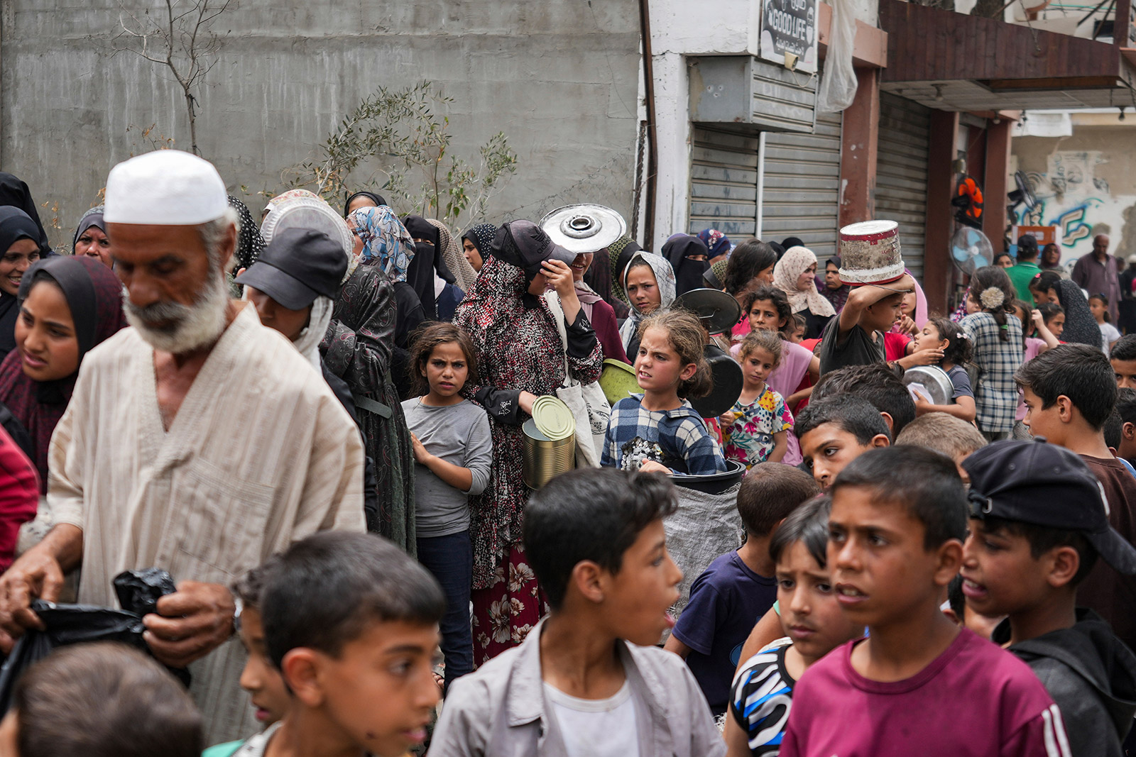 Palestinians line up for food distribution in Deir al Balah, Gaza, Friday, May 10.
