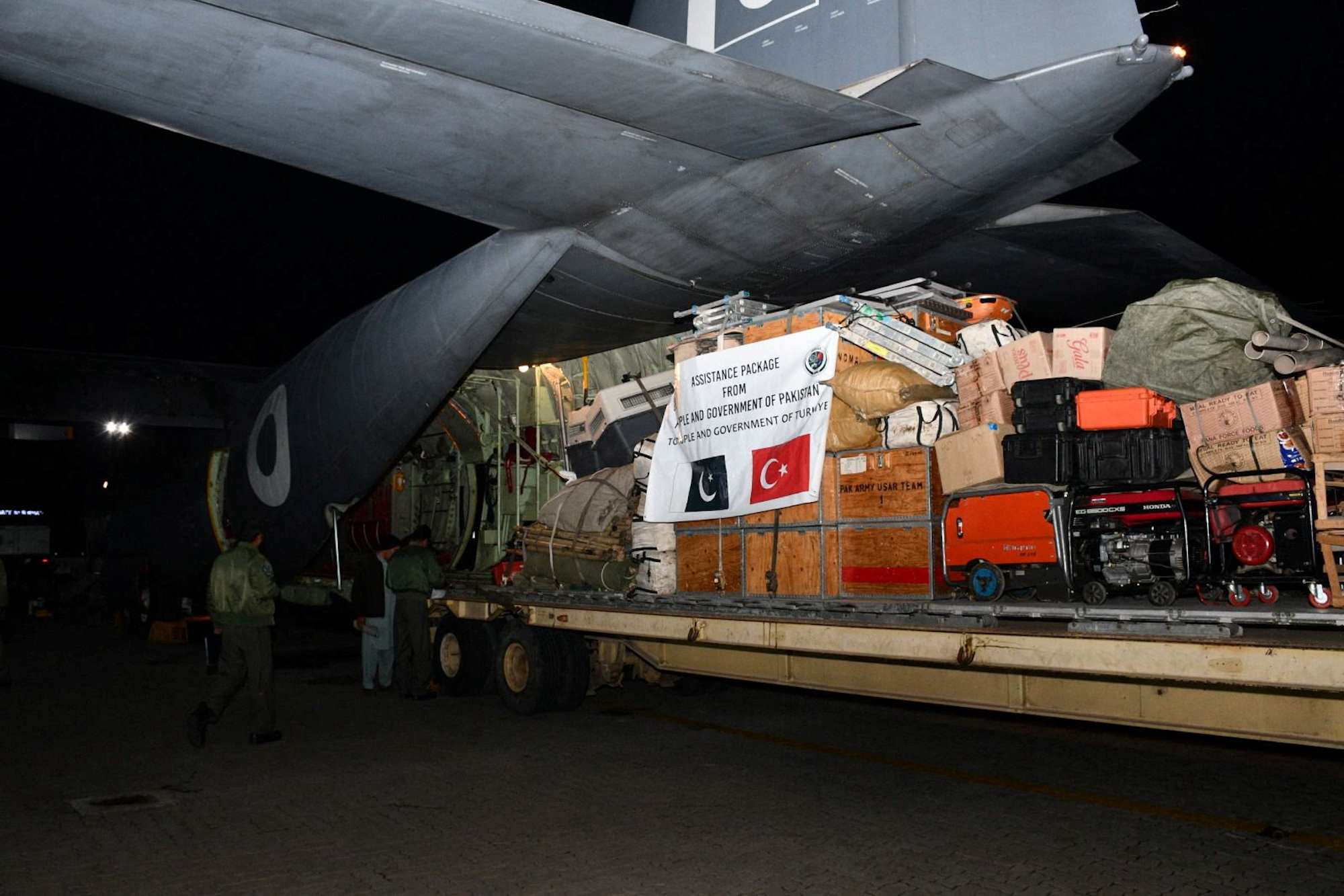 A Pakistani Air Force aircraft is loaded with supplies before its departure to Turkey at Nur Khan airbase in Rawalpindi, Pakistan, on Tuesday.