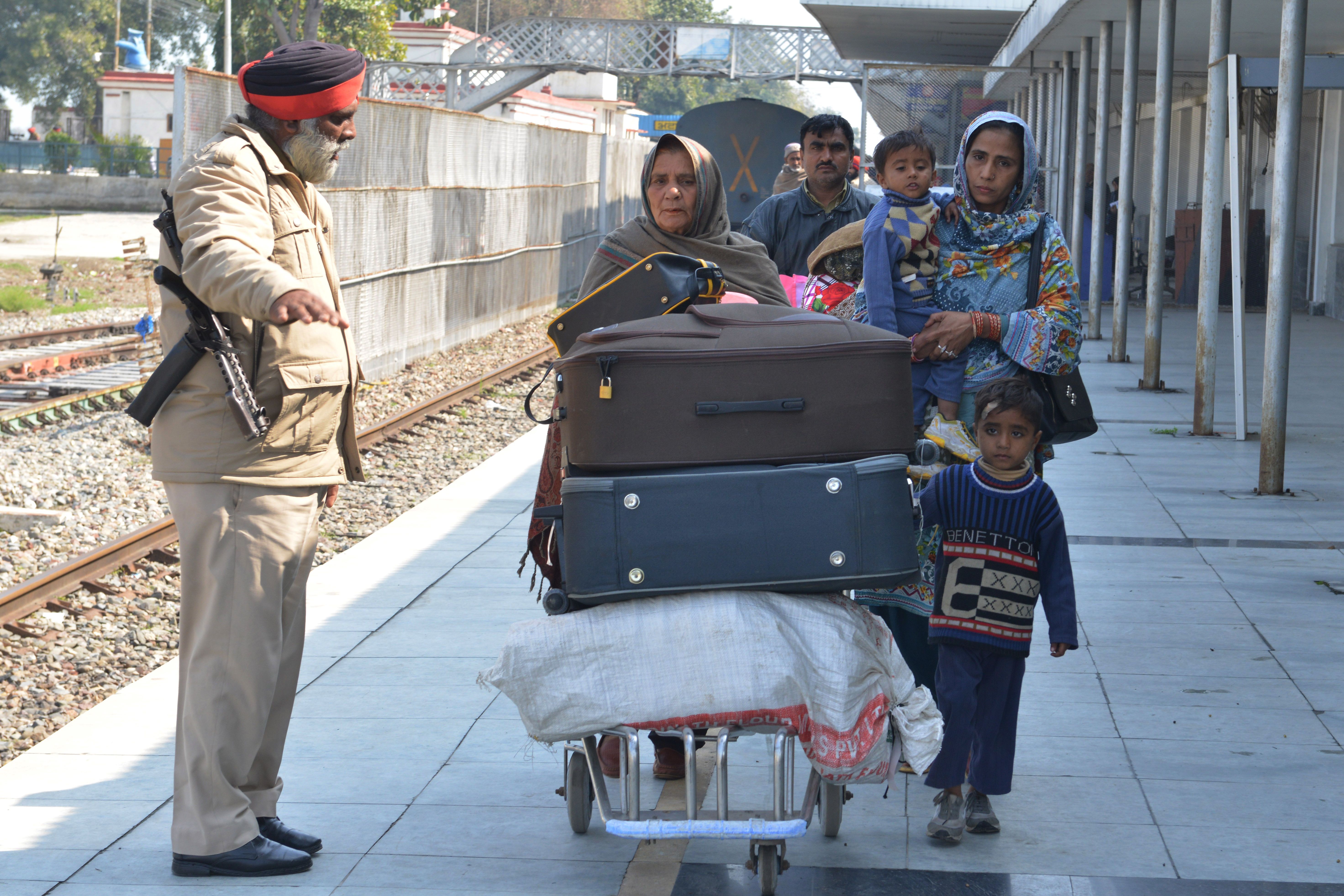 Stranded Pakistani passengers leave Attari Railway station on Thursday, following the temporary suspension by the Pakistani authorities of the Samjhauta Express rail service.