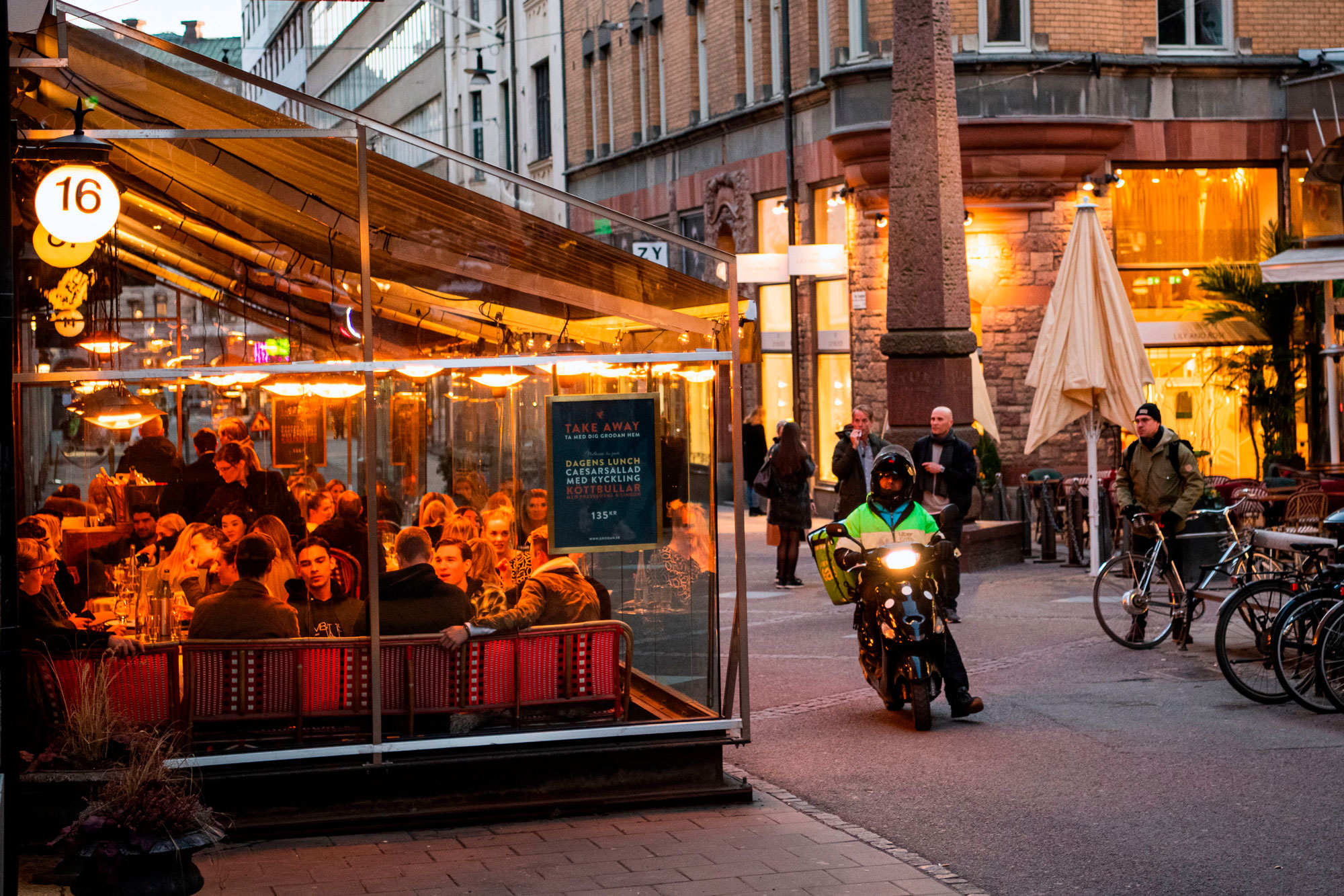People dine in a restaurant on March 27 in Stockholm, Sweden.