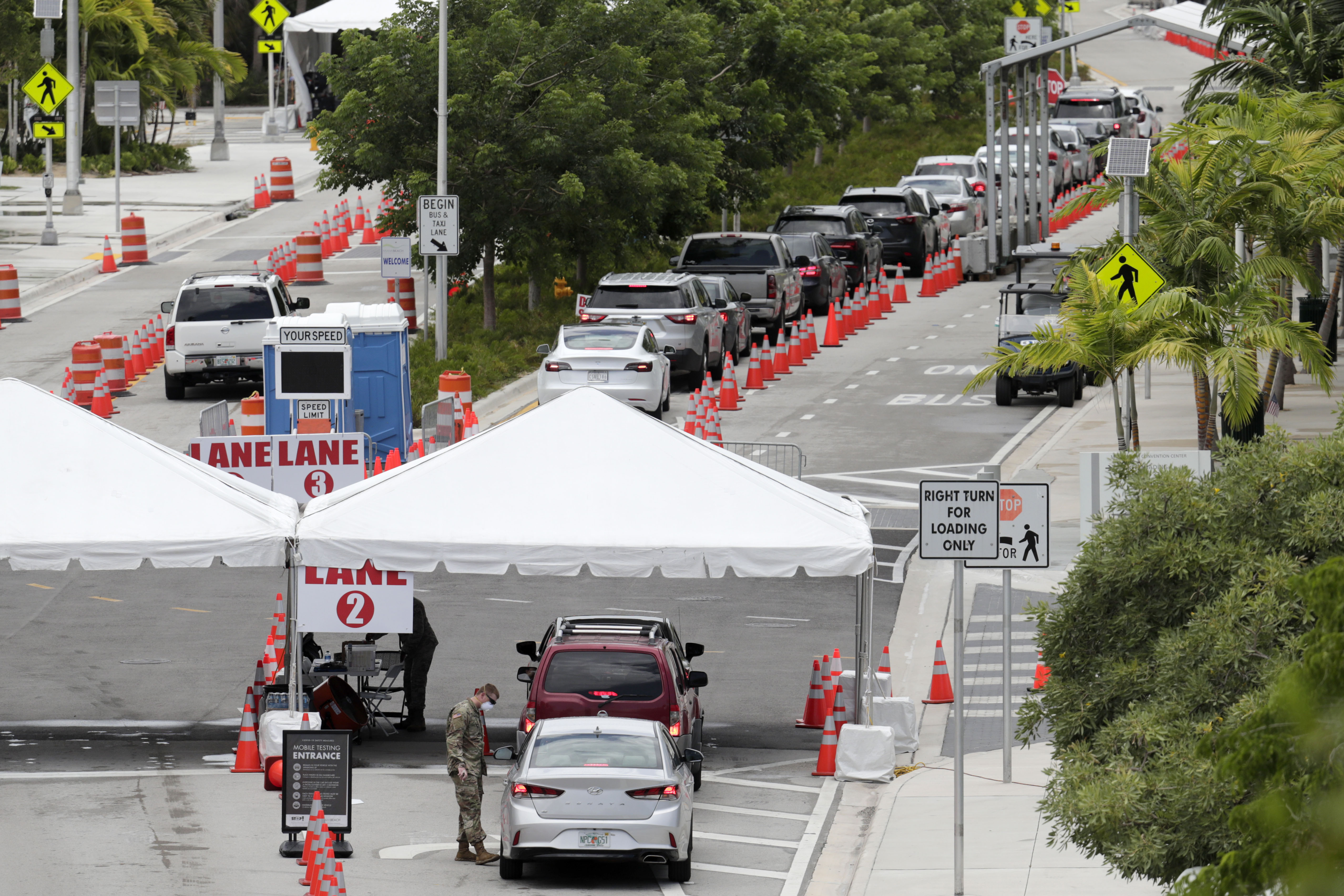People line up in cars at a Covid-19 testing site in Miami Beach, Florida, on July 12.