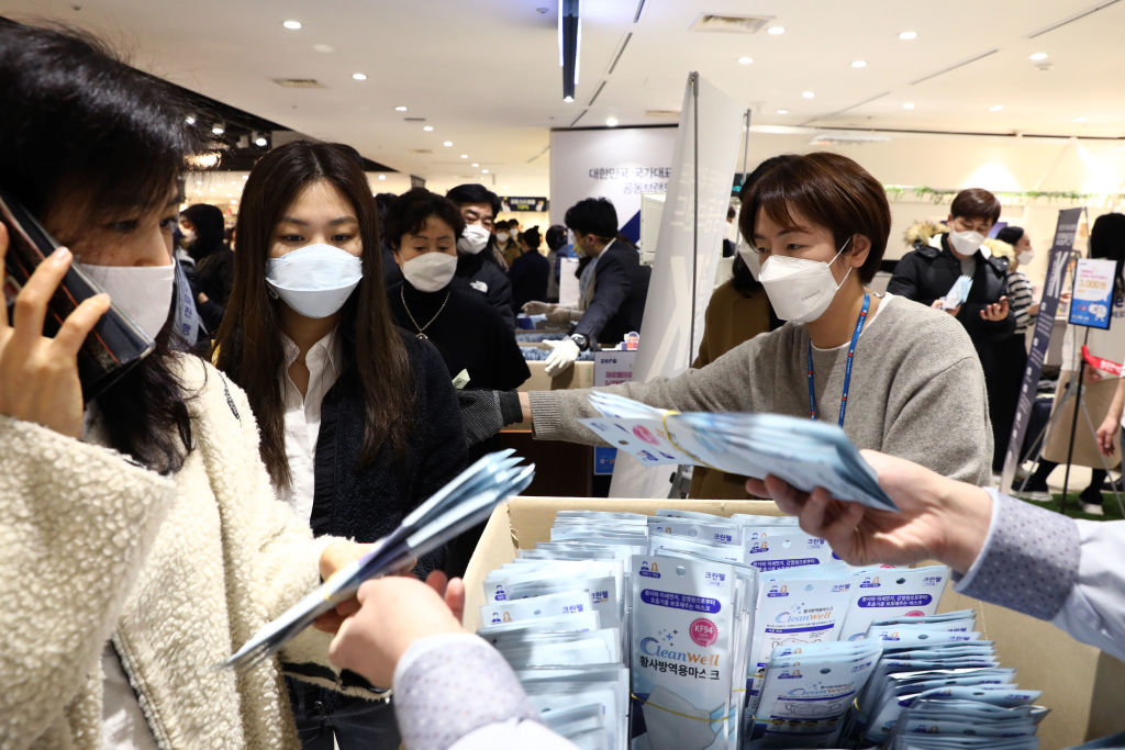 People buy face masks at a department store on February 28, in Seoul, South Korea.