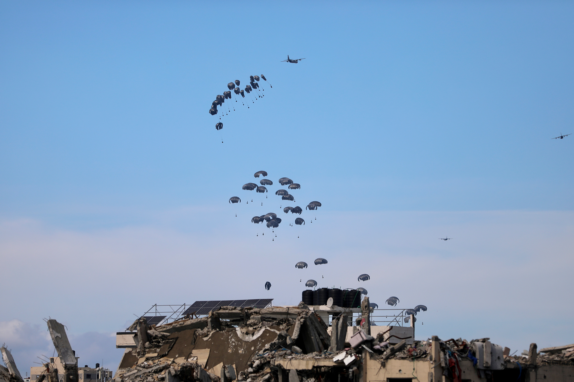 The United States Air Force drops humanitarian aid into Gaza Strip on Saturday, March 9. 