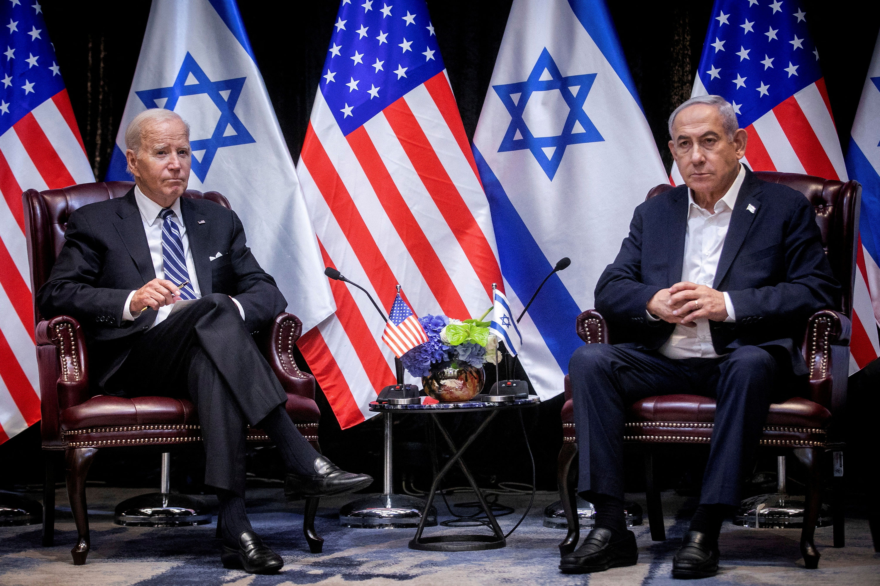 President Joe Biden and Israeli Prime Minister Benjamin Netanyahu pose for photos before a meeting in Tel Aviv, Israel, on October 18.