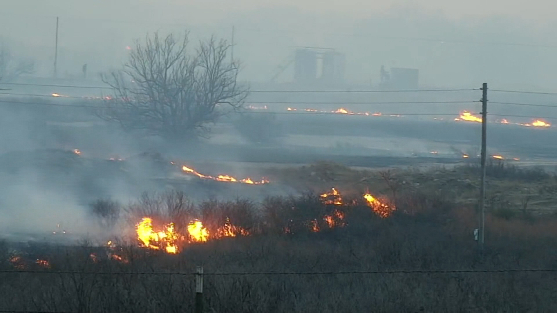 A wildfire is seen burning in Lefors, Texas, on Tuesday.