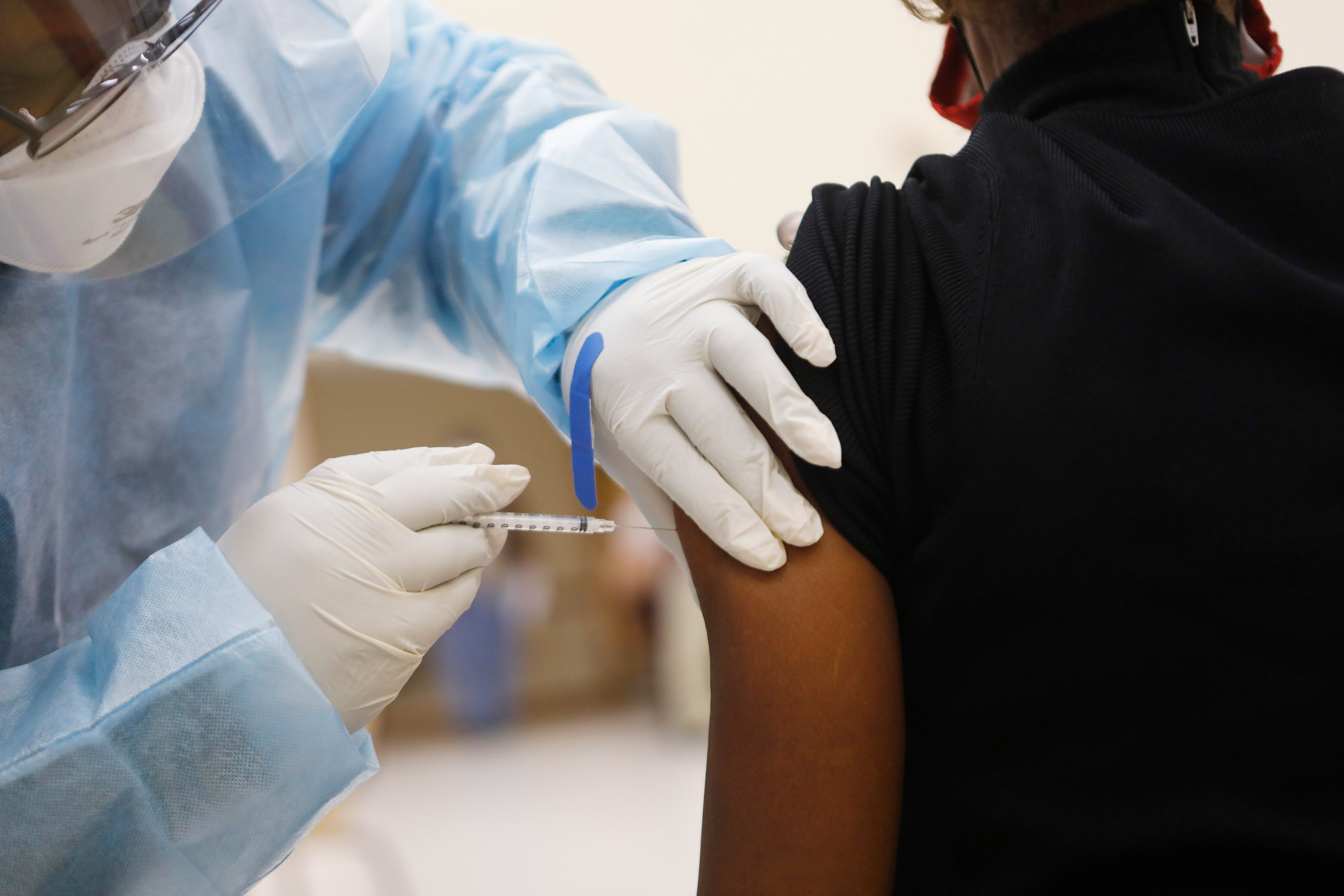 Healthcare workers administer the COVID-19 vaccine at St. Johns Missionary Baptist Church on January 10 in Tampa, Florida. 