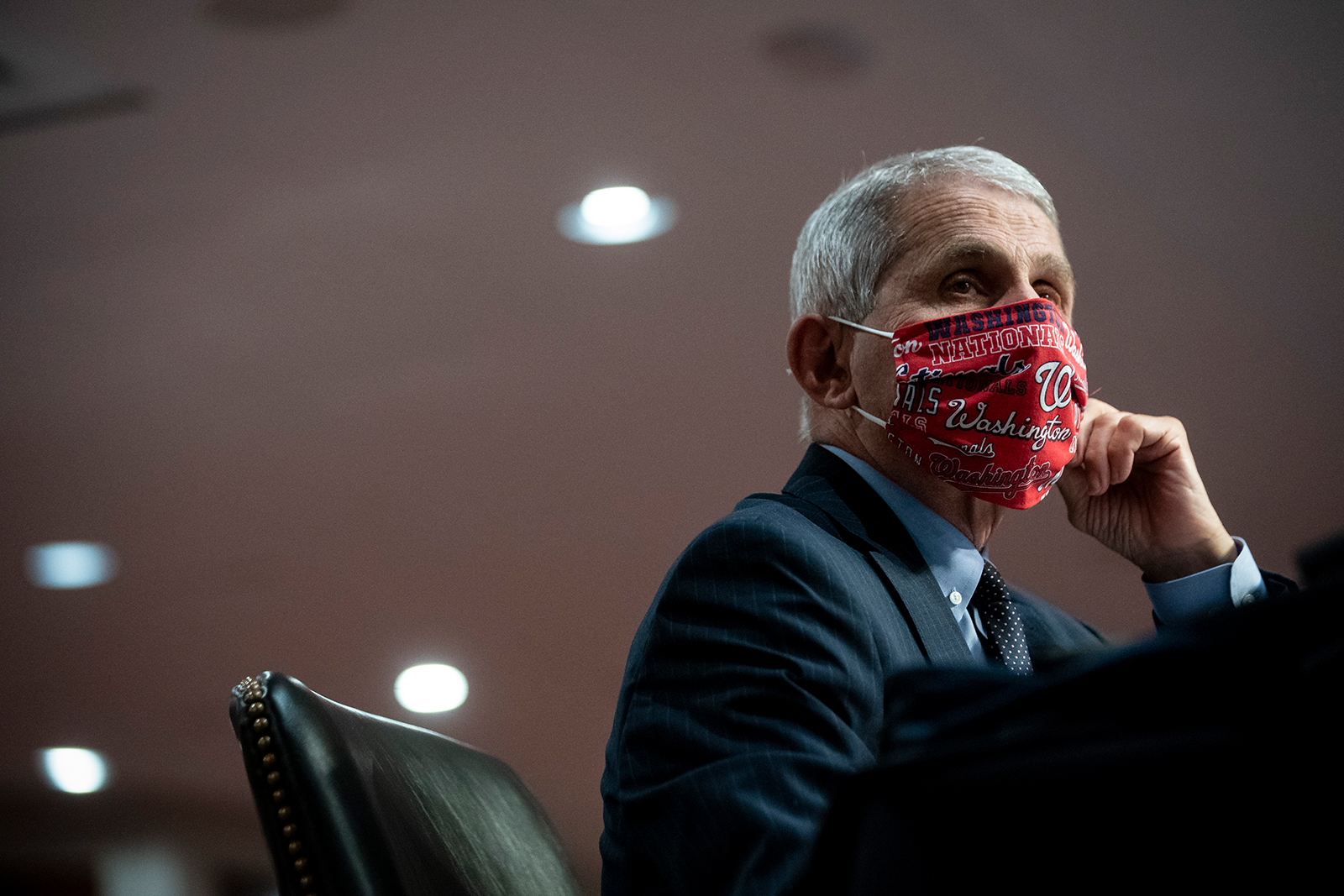 Dr. Anthony Fauci, director of the National Institute of Allergy and Infectious Diseases, wears a face covering as he listens during a Senate Health, Education, Labor and Pensions Committee hearing on June 30, in Washington.
