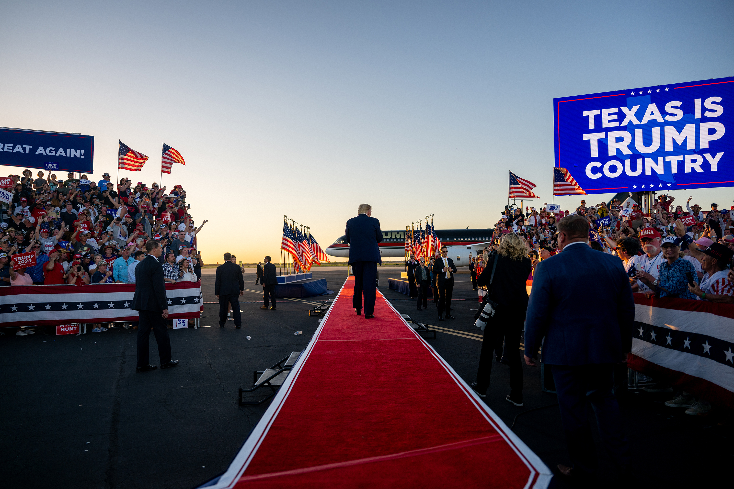Former President Donald Trump exits after speaking during a rally at the Waco Regional Airport on March 25 in Waco, Texas. 