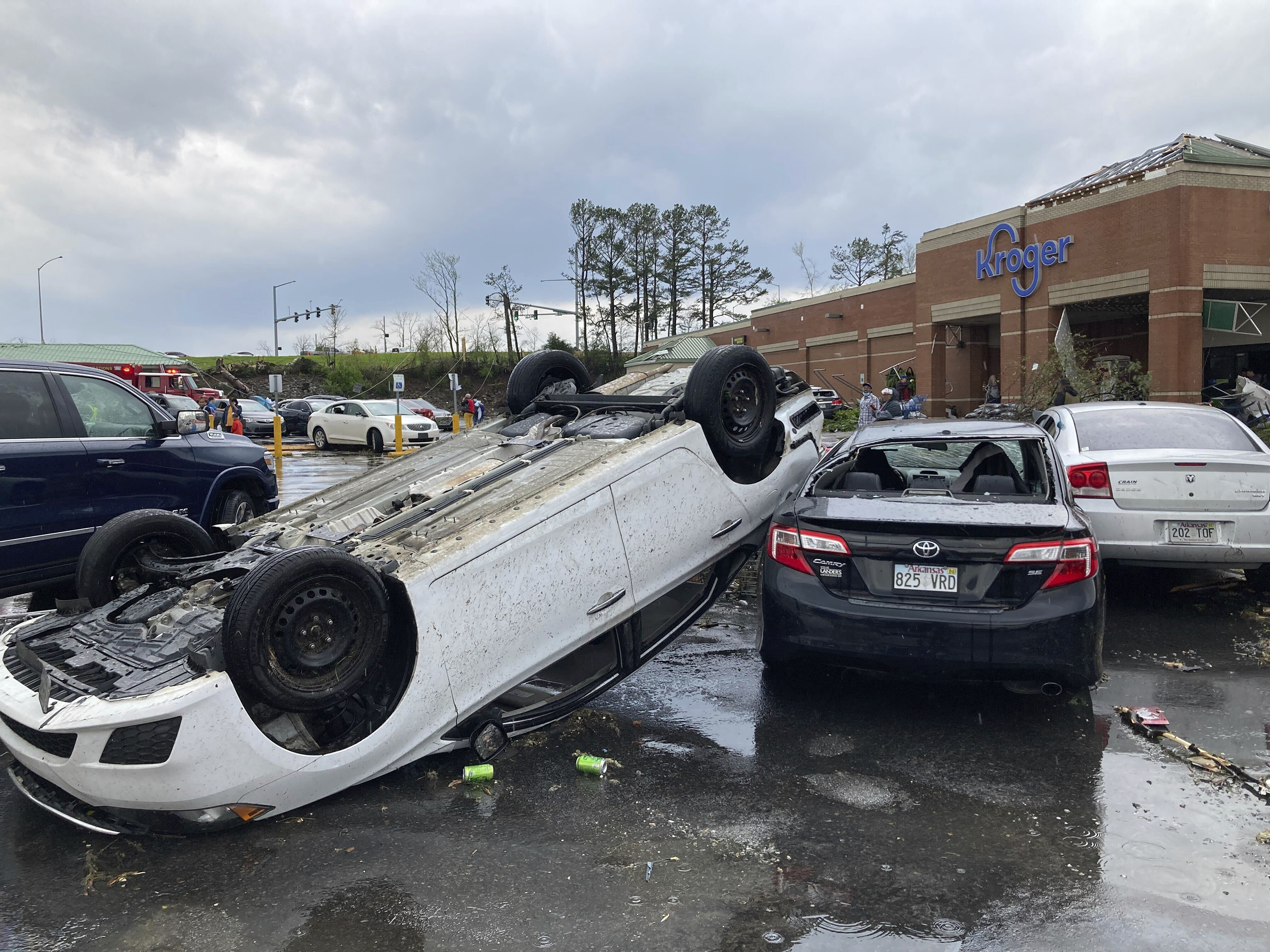 A car is upturned in a Kroger parking lot after a severe storm swept through Little Rock, Arkansas, Friday, March 31.